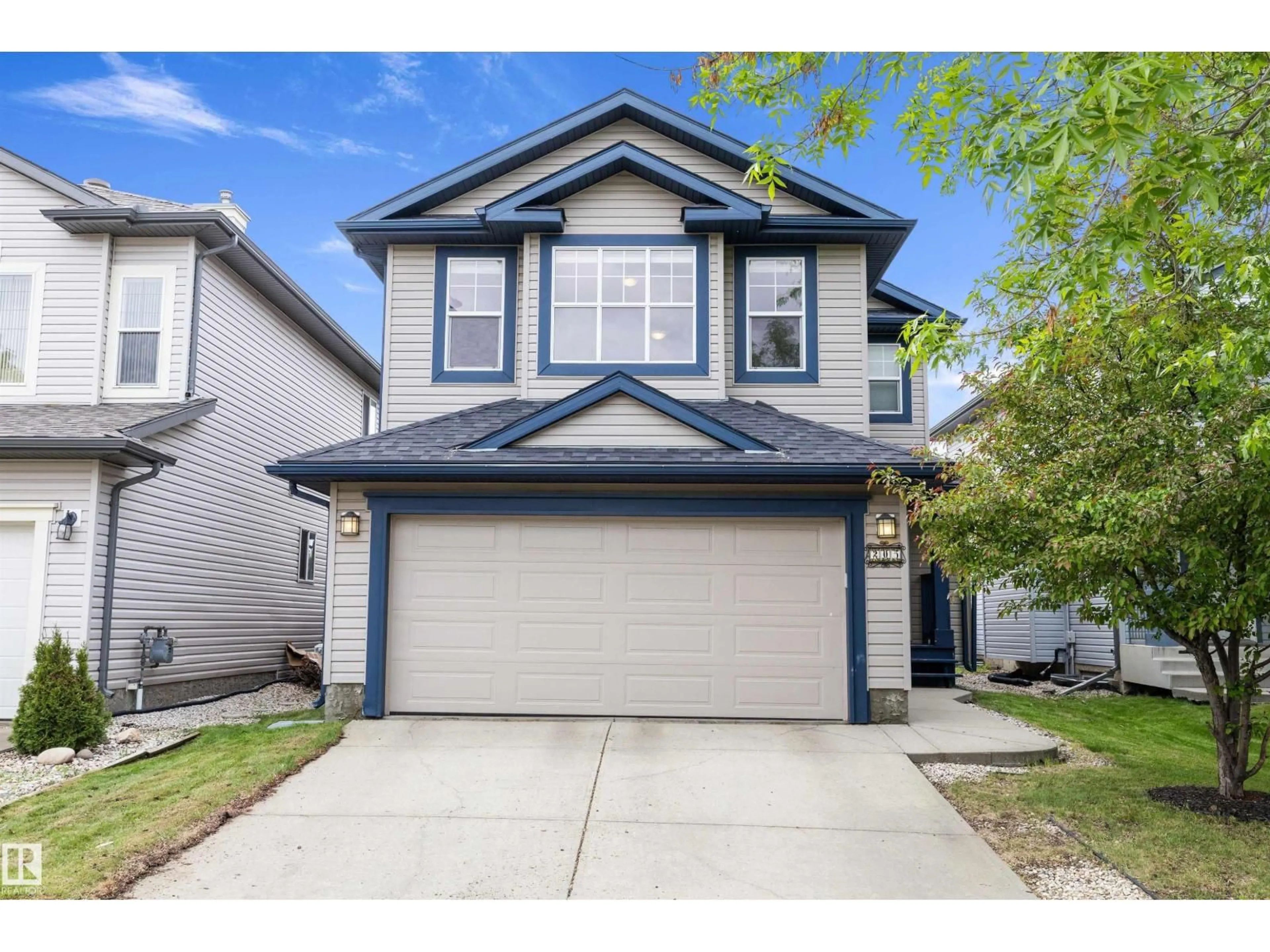 Home with vinyl exterior material, street for 205 MACEWAN RD, Edmonton Alberta T6W1R2