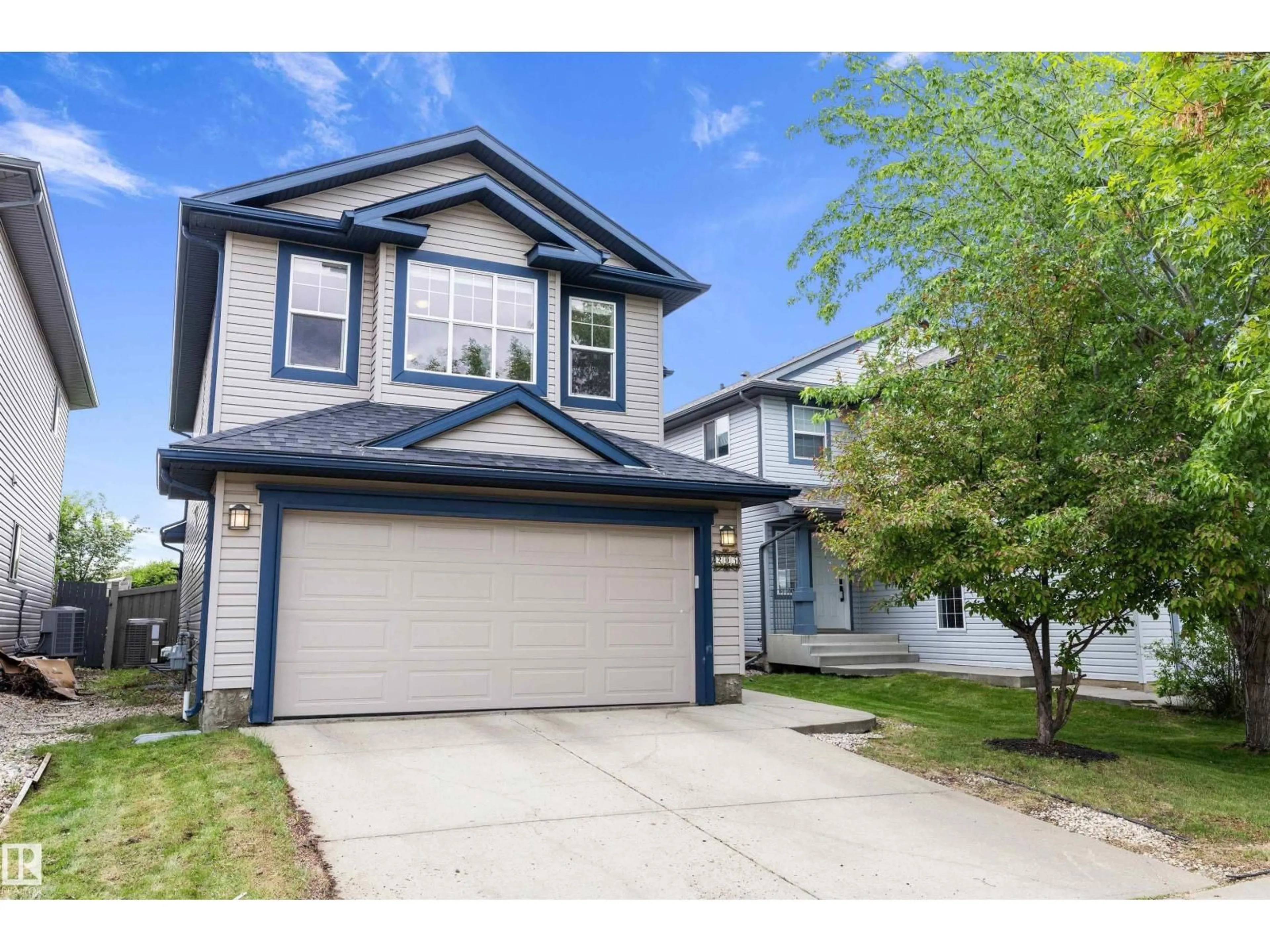 Home with vinyl exterior material, street for 205 MACEWAN RD, Edmonton Alberta T6W1R2