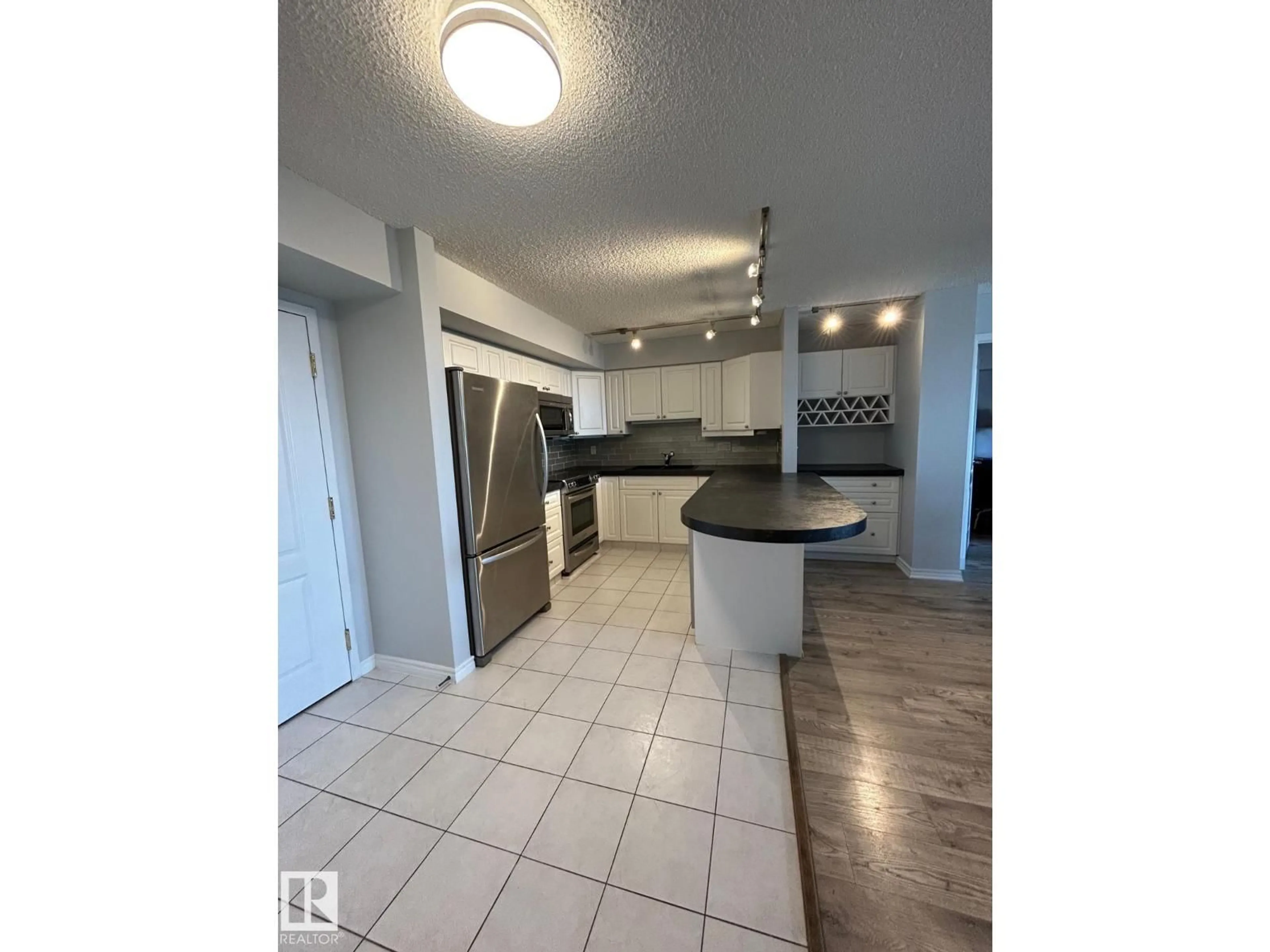 Open concept kitchen, unknown for 10909 NW - 1506 103 AV, Edmonton Alberta T5K2W7