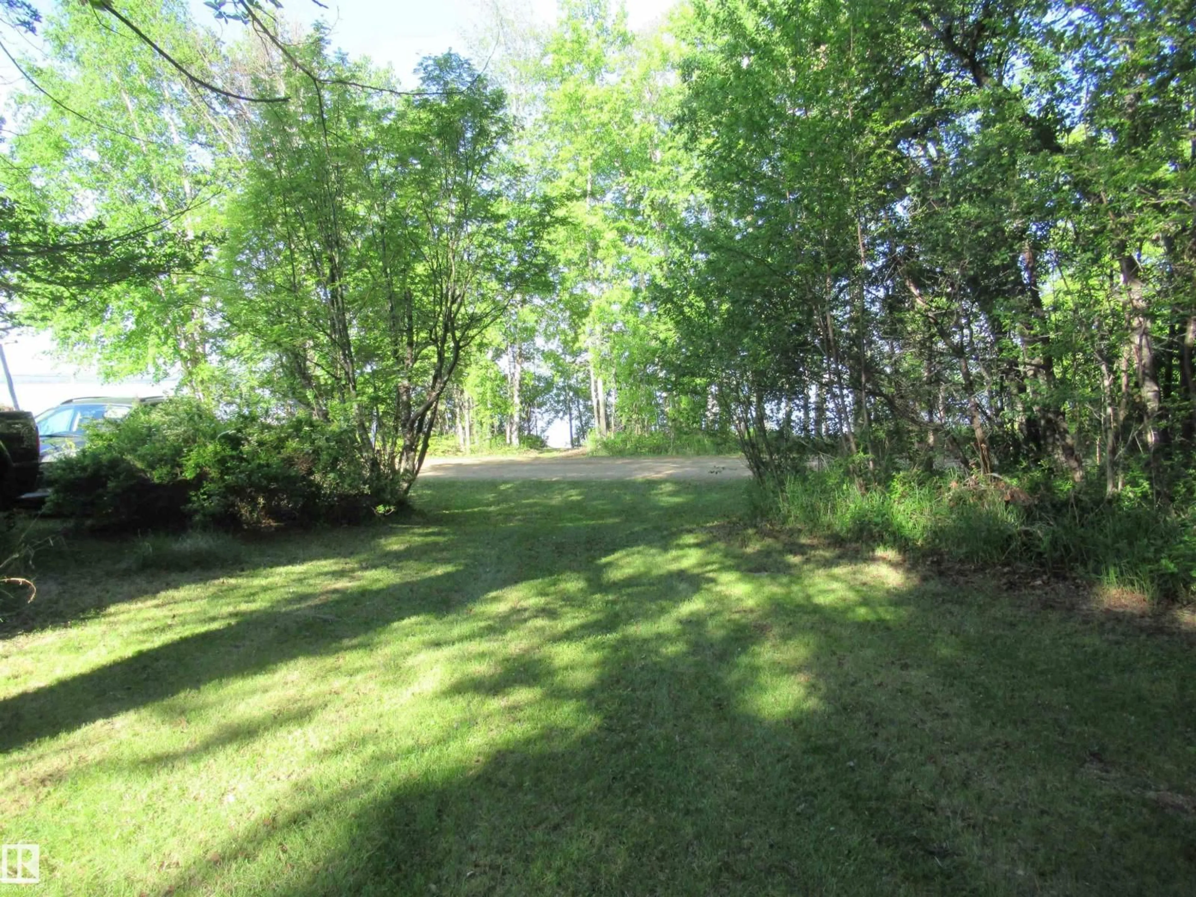 A pic from outside/outdoor area/front of a property/back of a property/a pic from drone, forest/trees view for 64 SUNDANCE BE, Rural Leduc County Alberta T0C2P0