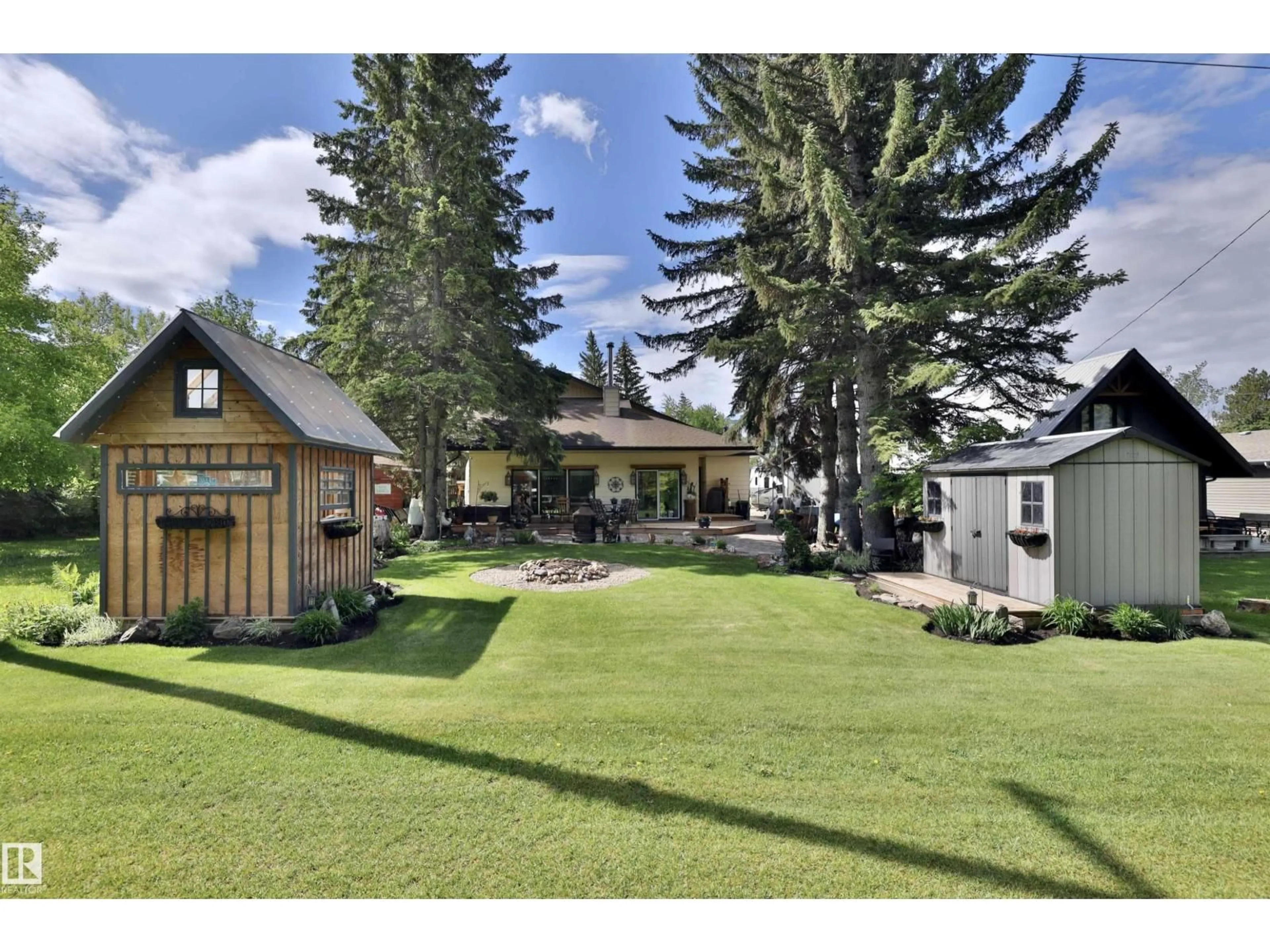 A pic from outside/outdoor area/front of a property/back of a property/a pic from drone, mountain view for 4652 50 AV, Rural Wetaskiwin County Alberta T0C2C0