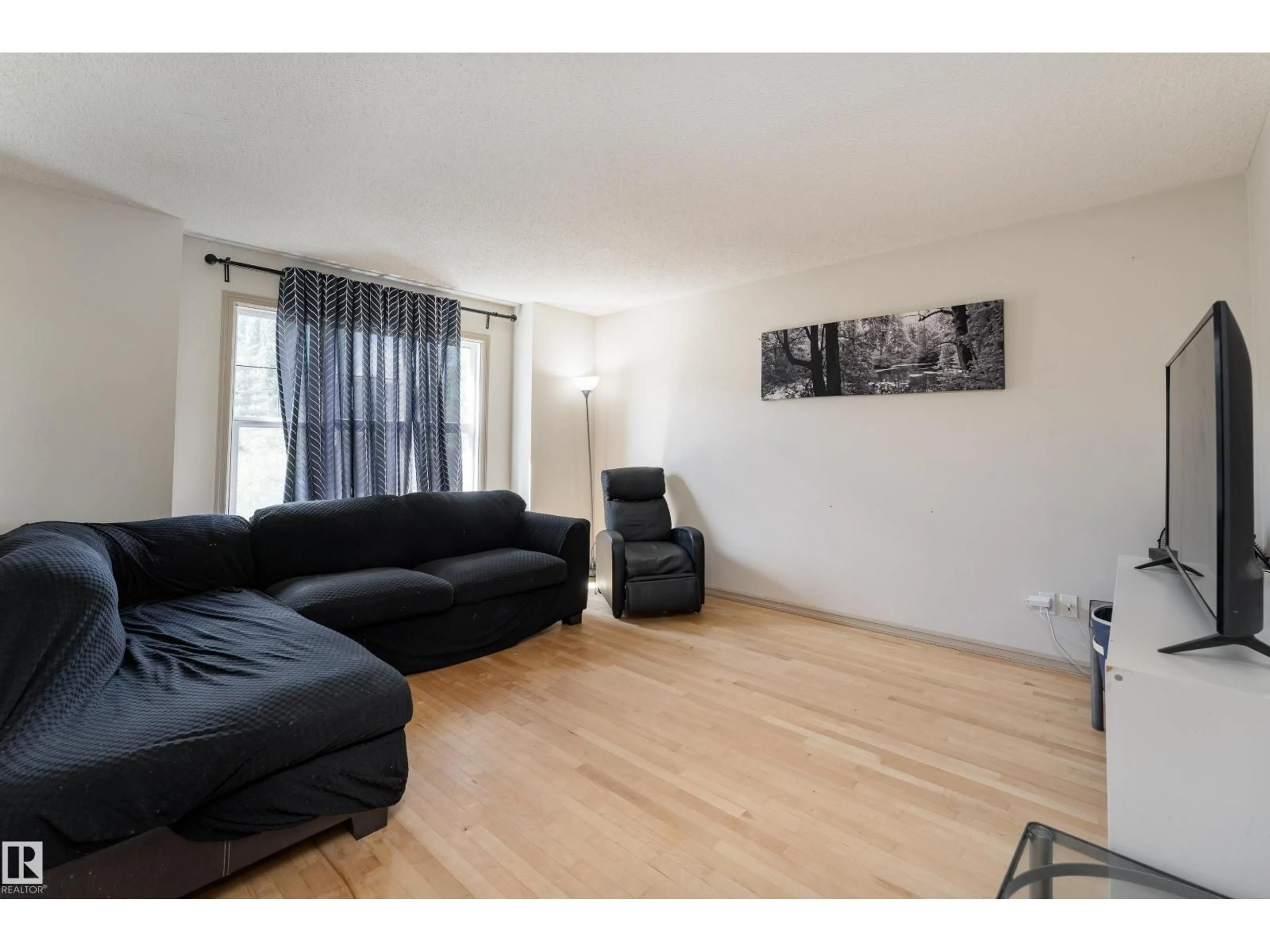 Living room with furniture, wood/laminate floor for NW - 14715 141 ST, Edmonton Alberta T6V0A8