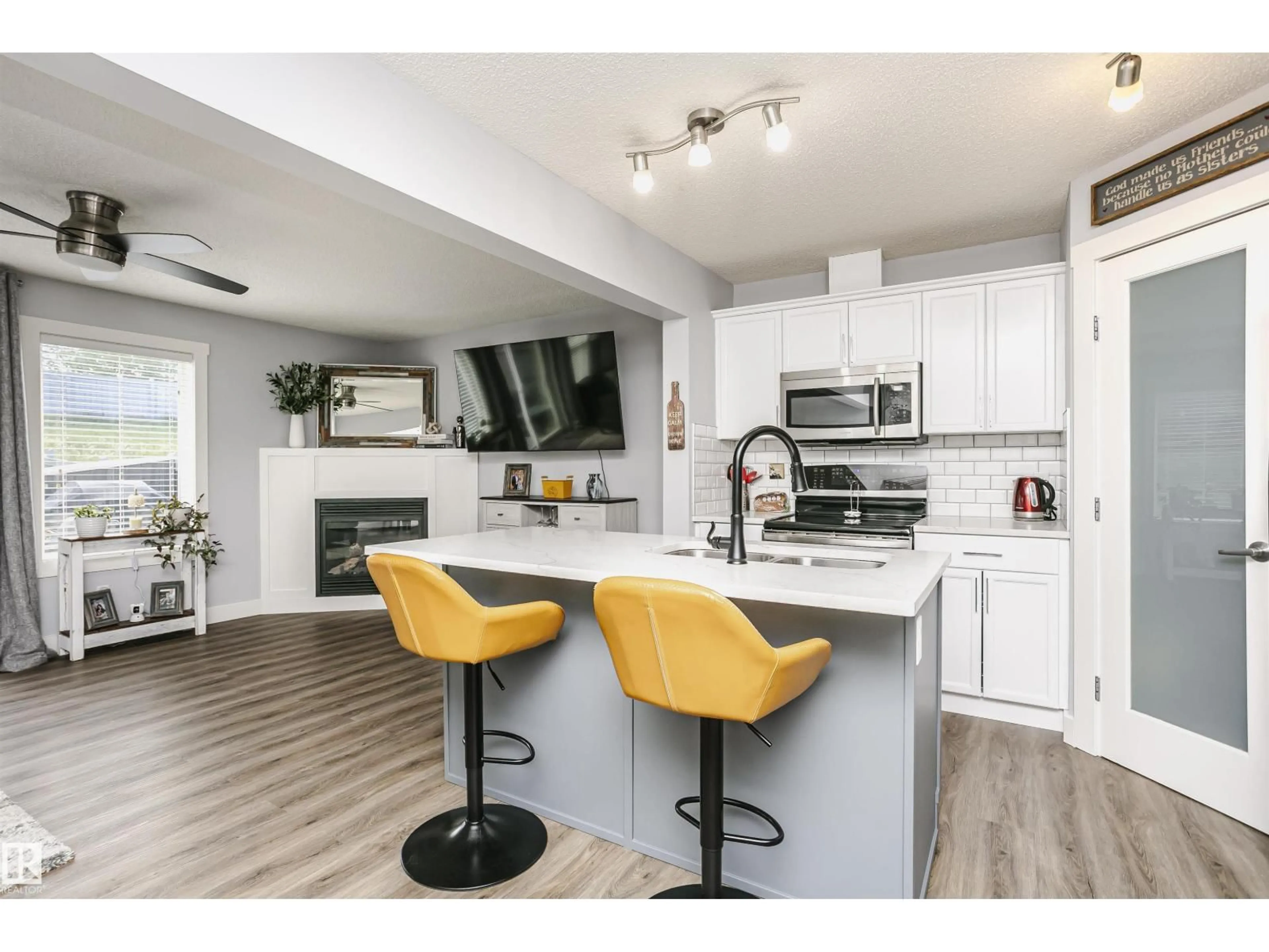 Open concept kitchen, wood/laminate floor for NW - 3713 11 ST, Edmonton Alberta T6T0E8