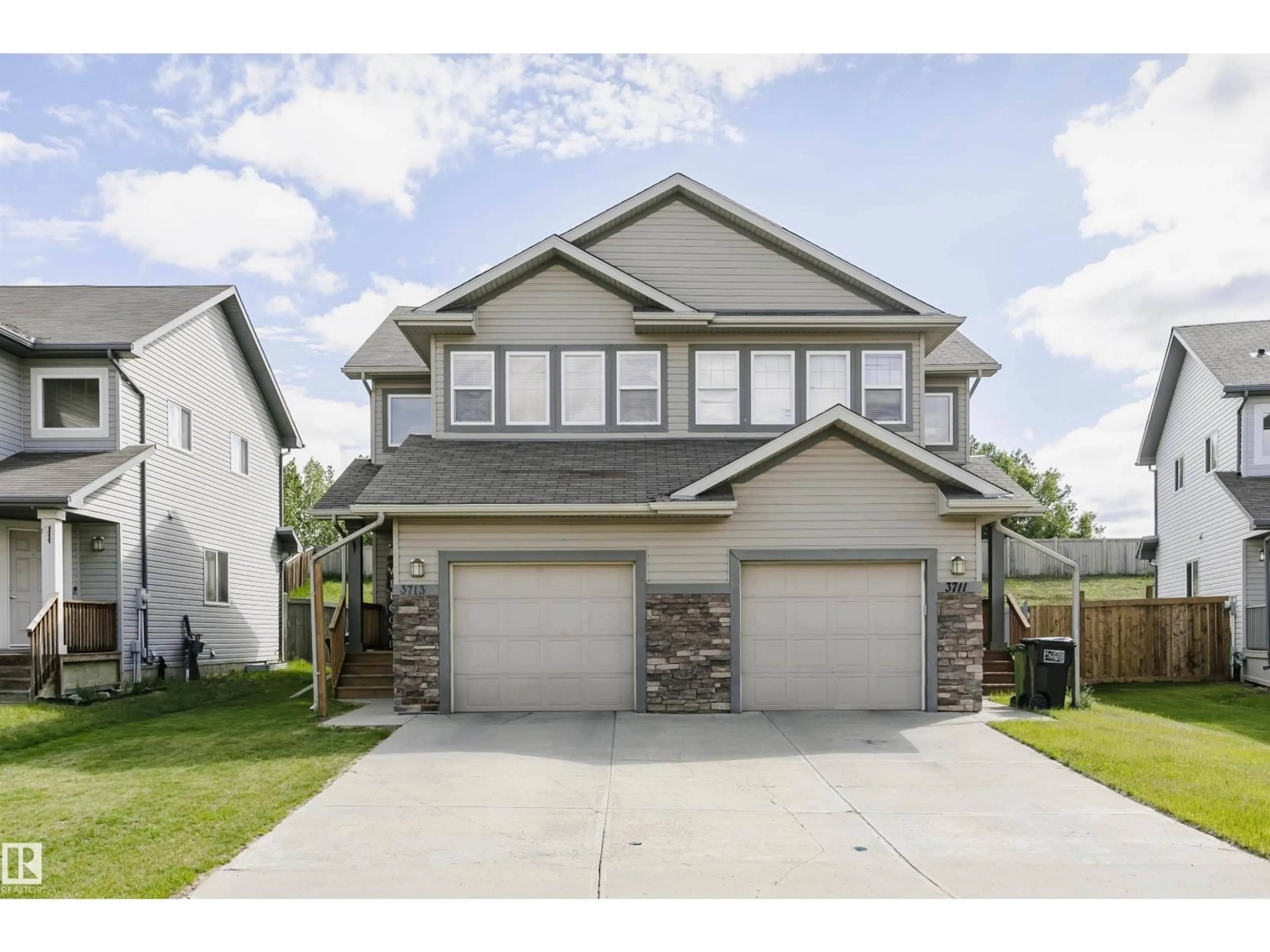 Home with vinyl exterior material, street for NW - 3713 11 ST, Edmonton Alberta T6T0E8