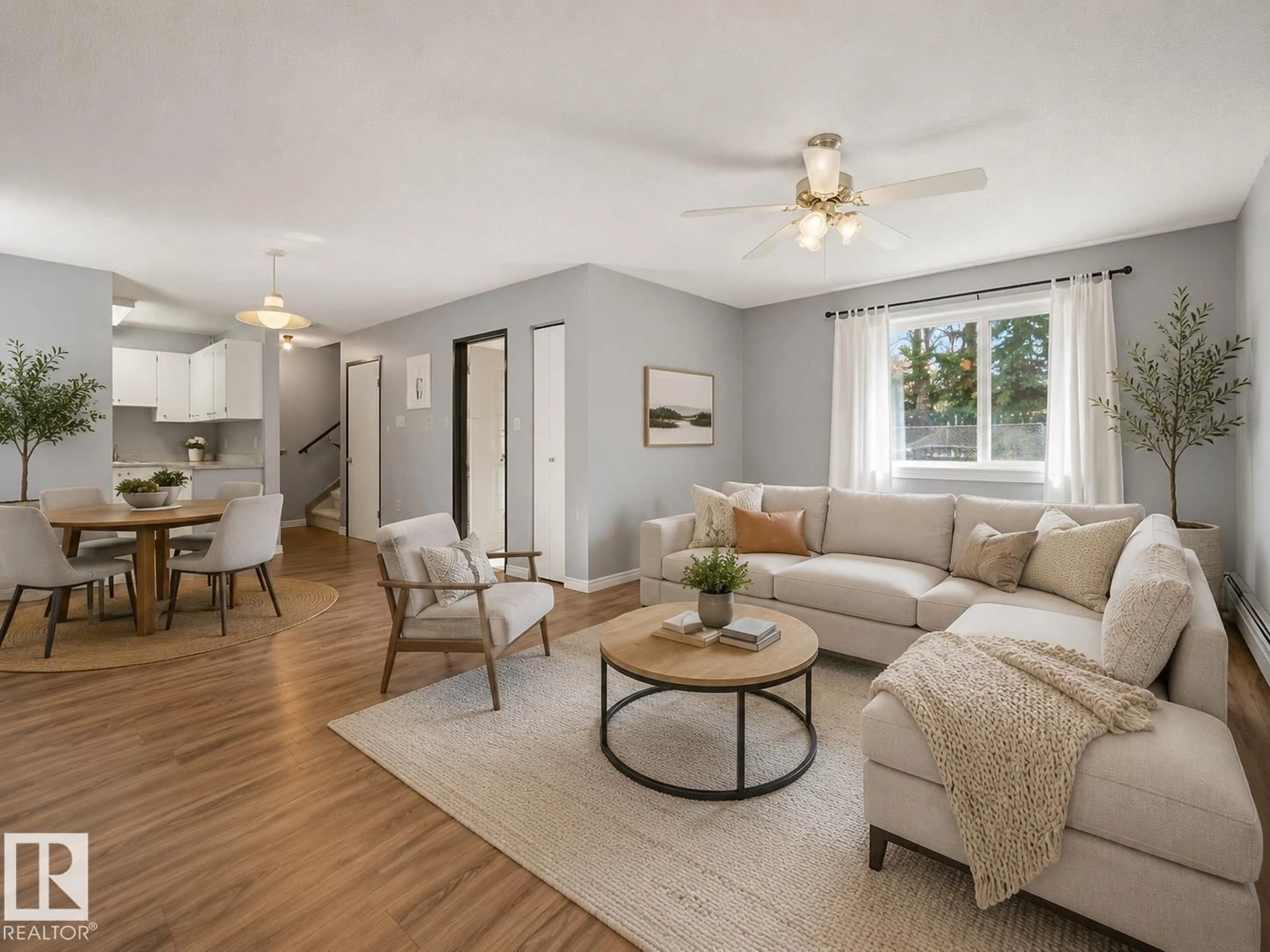 Living room with furniture, wood/laminate floor for 13450 FORT RD, Edmonton Alberta T5A1C5