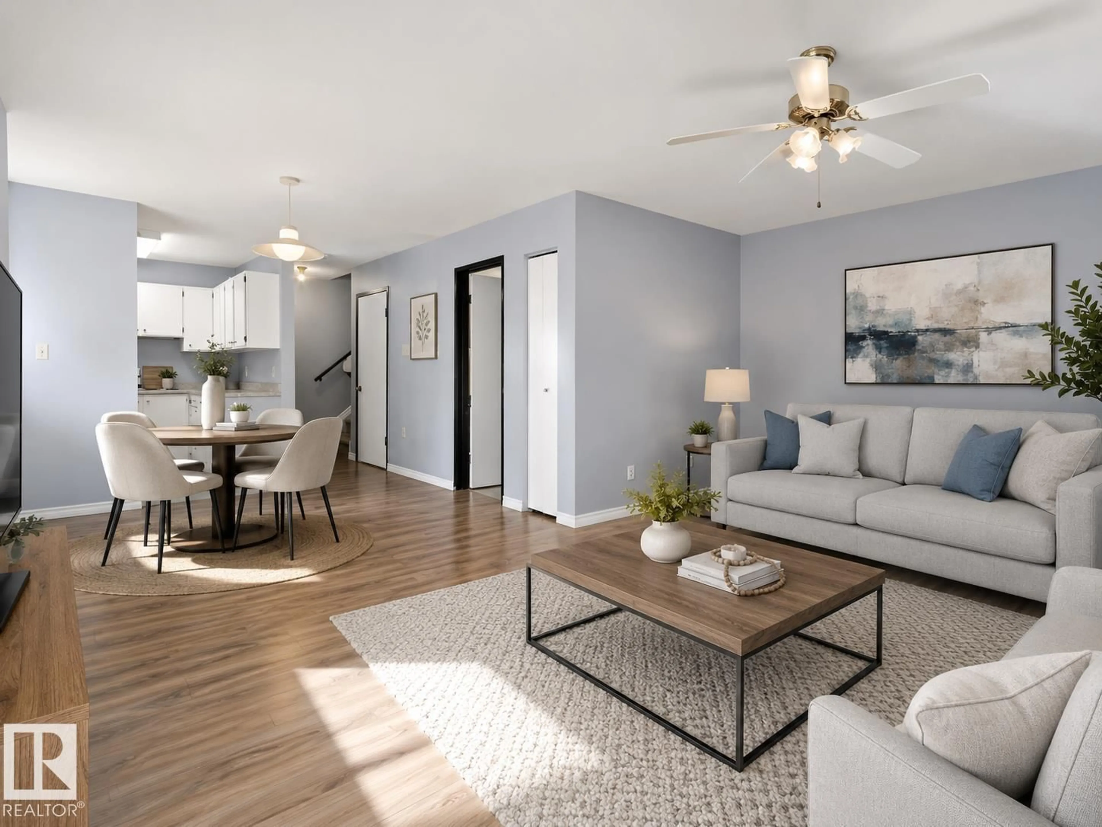 Living room with furniture, wood/laminate floor for 13450 FORT RD, Edmonton Alberta T5A1C5