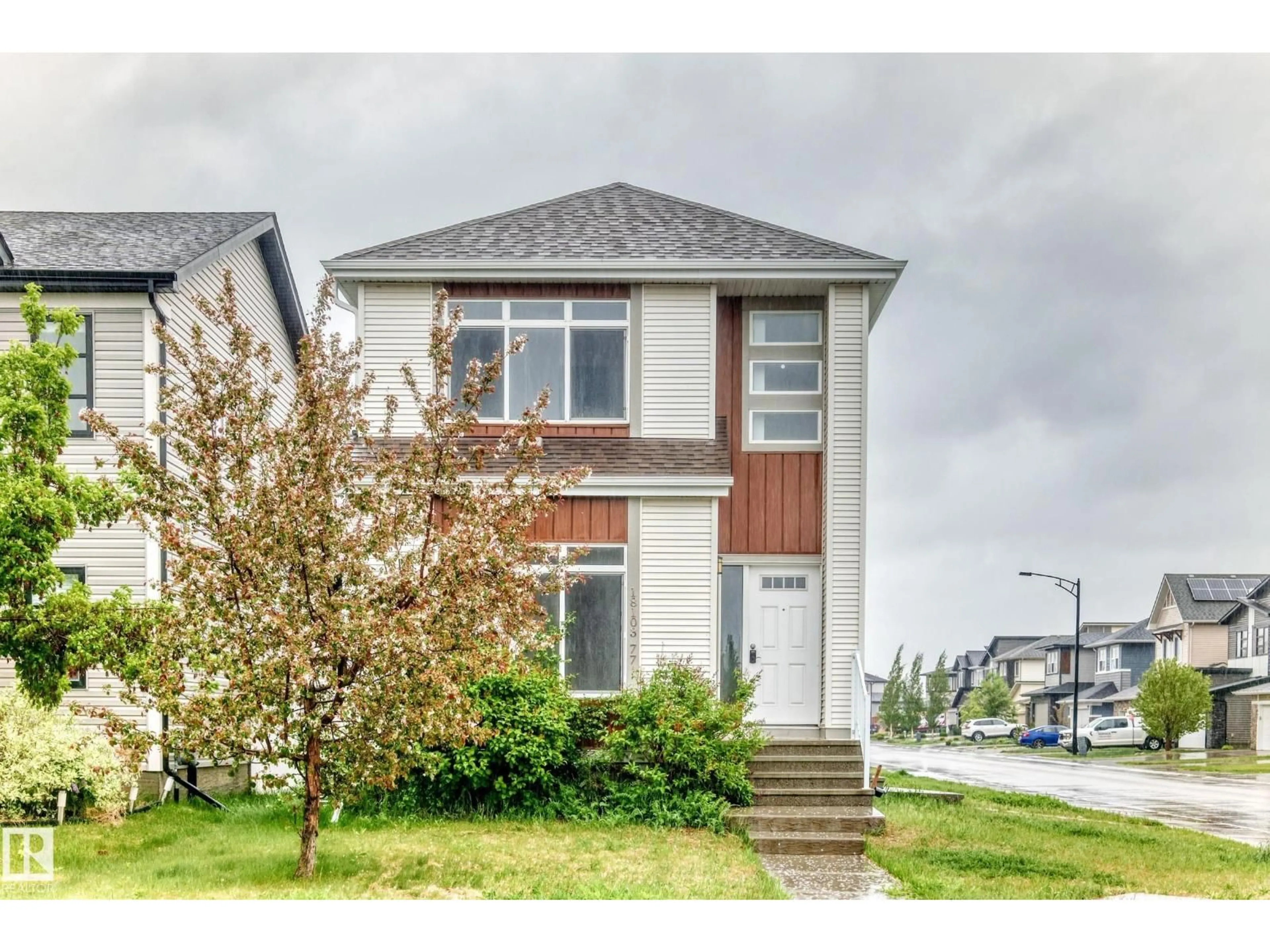 Home with vinyl exterior material, street for 18103 77 ST, Edmonton Alberta T5Z0L8