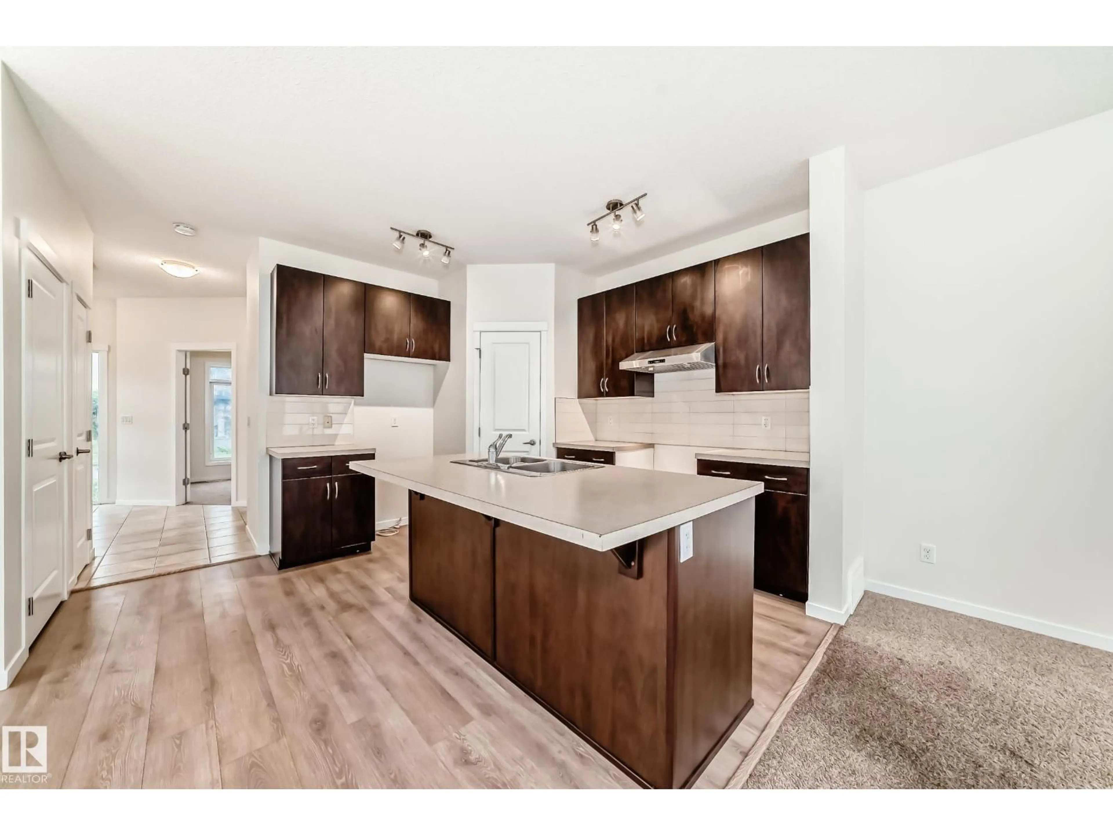 Open concept kitchen, wood/laminate floor for 18103 77 ST, Edmonton Alberta T5Z0L8