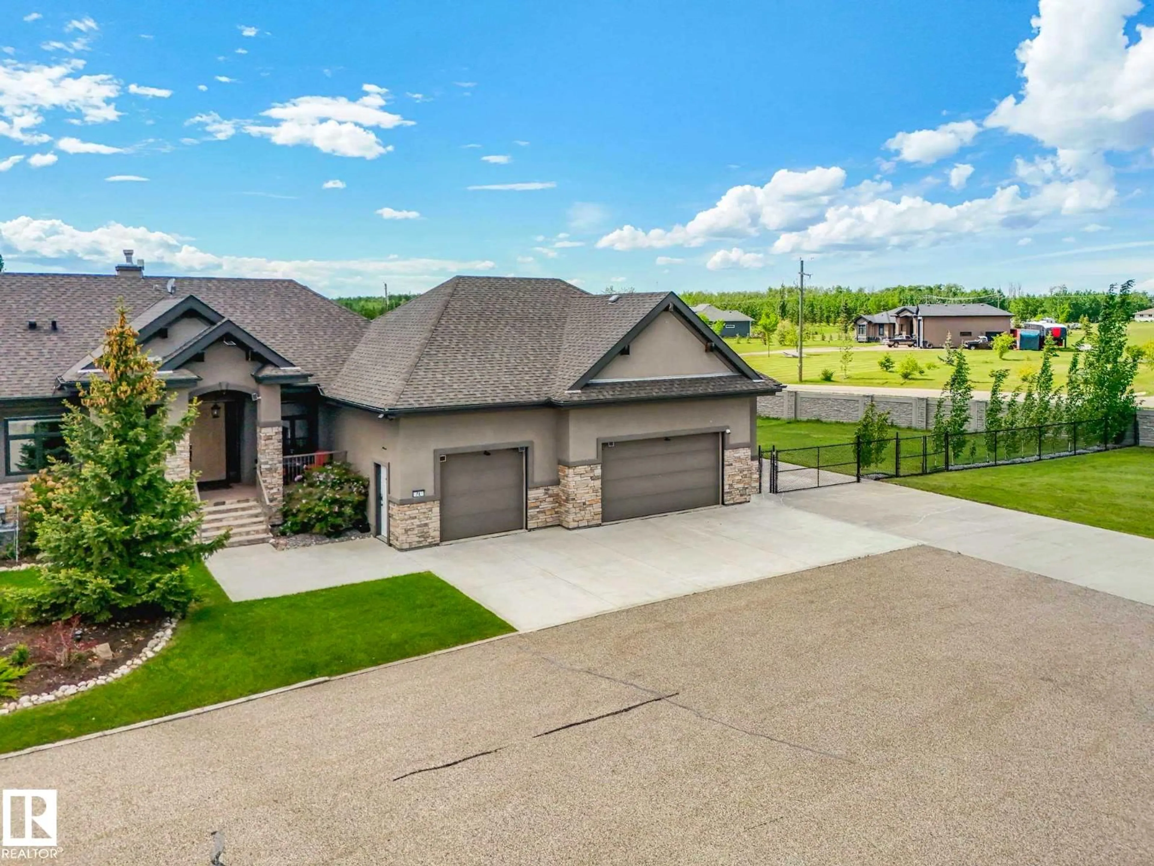 A pic from outside/outdoor area/front of a property/back of a property/a pic from drone, unknown for 1A - 53521 RGE RD 272, Rural Parkland County Alberta T7X3M5