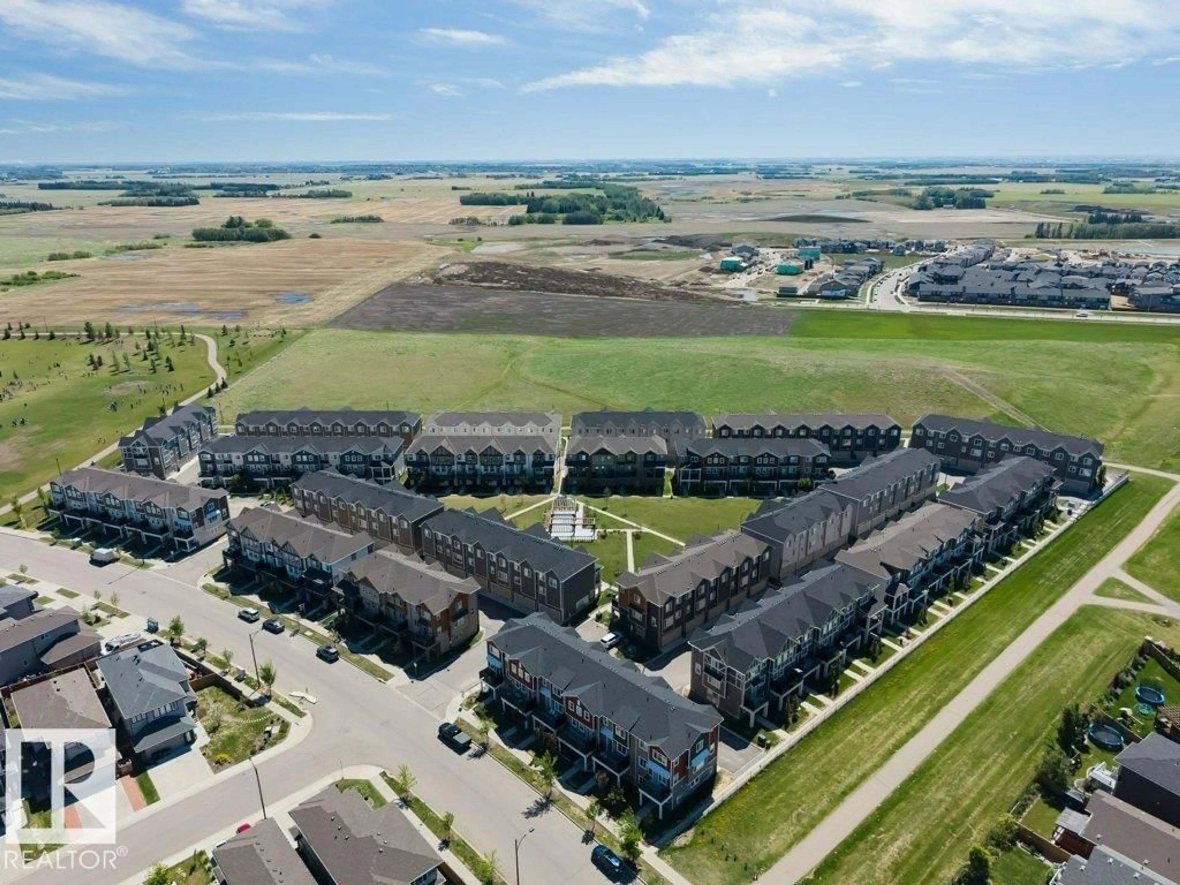 A pic from outside/outdoor area/front of a property/back of a property/a pic from drone, unknown for 105 - 2072 WONNACOTT WY, Edmonton Alberta T6X2V7