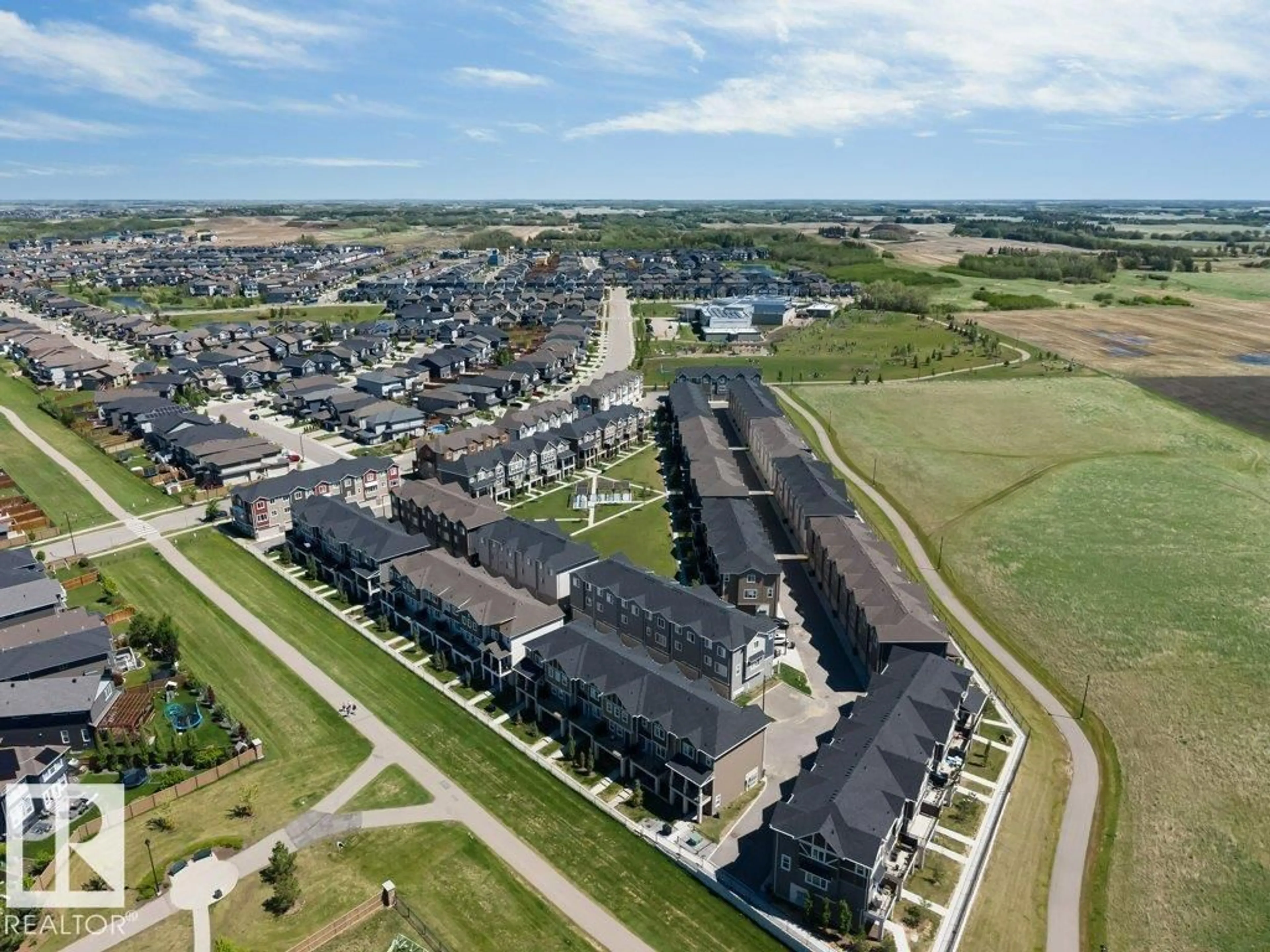 A pic from outside/outdoor area/front of a property/back of a property/a pic from drone, unknown for 105 - 2072 WONNACOTT WY, Edmonton Alberta T6X2V7
