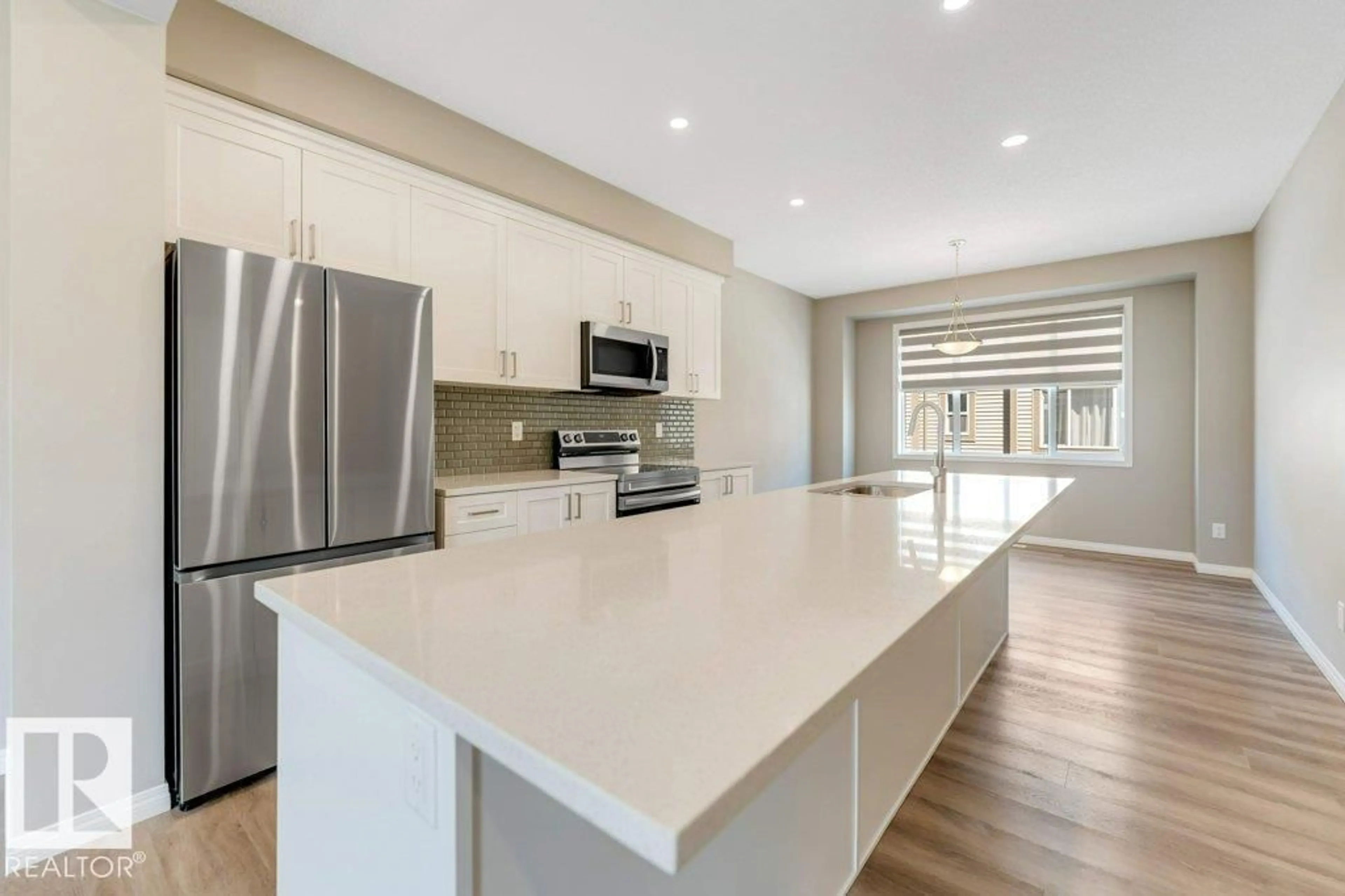 Open concept kitchen, ceramic/tile floor for 105 - 2072 WONNACOTT WY, Edmonton Alberta T6X2V7
