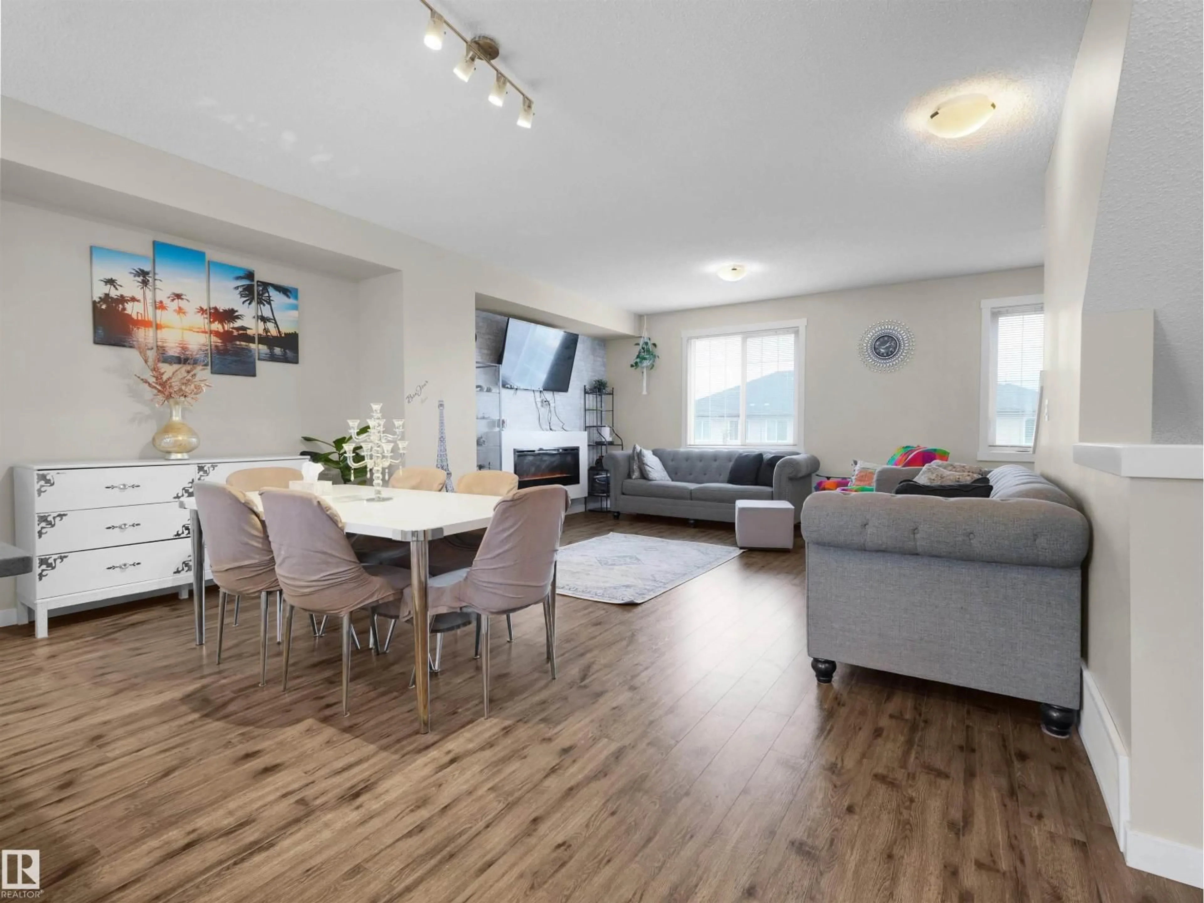 Living room with furniture, wood/laminate floor for 4 - 735 ALLARD BV, Edmonton Alberta T6W3W5