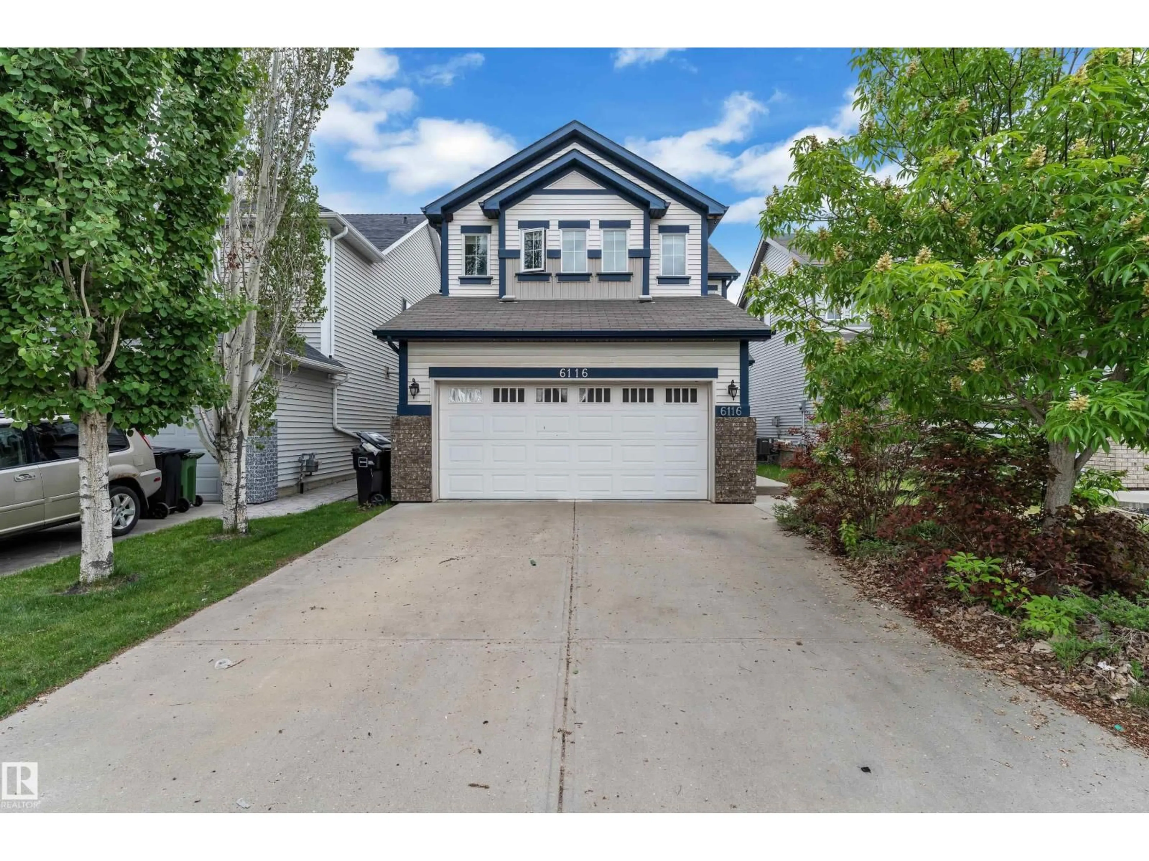Home with vinyl exterior material, street for 6116 11 AV, Edmonton Alberta T6X0M4