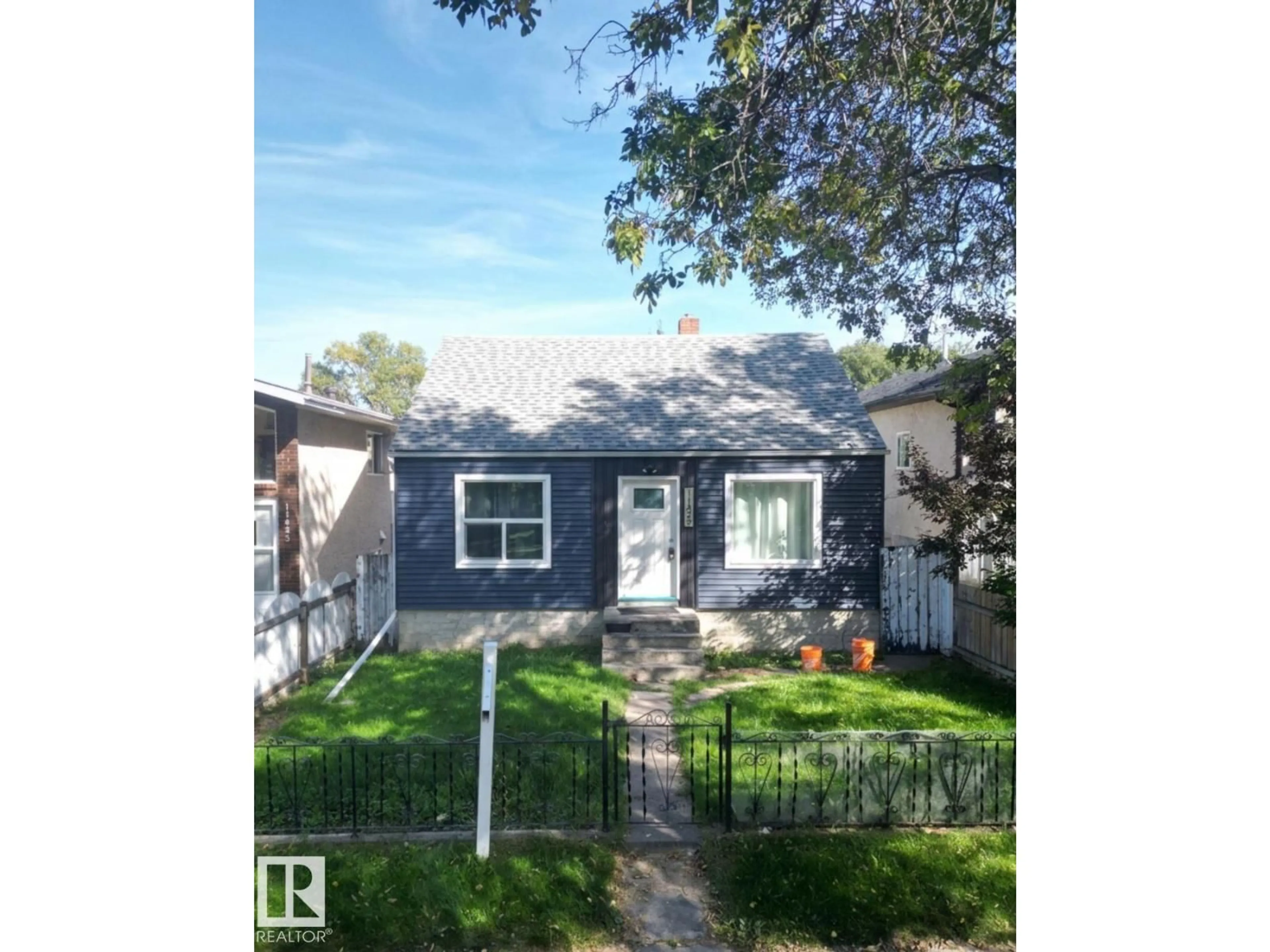 Home with vinyl exterior material, street for 11429 89 ST, Edmonton Alberta T5B3T7