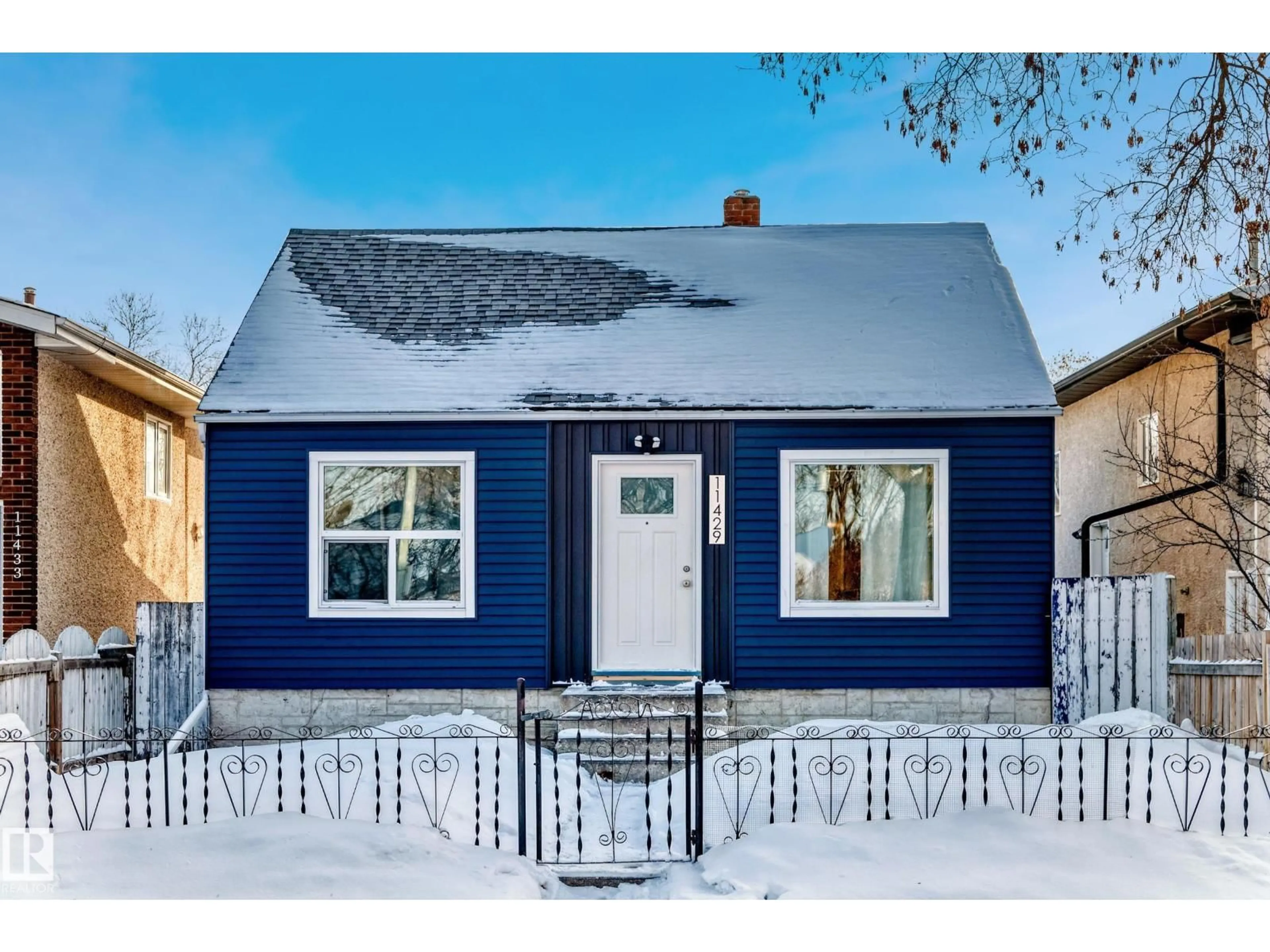 Home with vinyl exterior material, street for 11429 89 ST, Edmonton Alberta T5B3T7