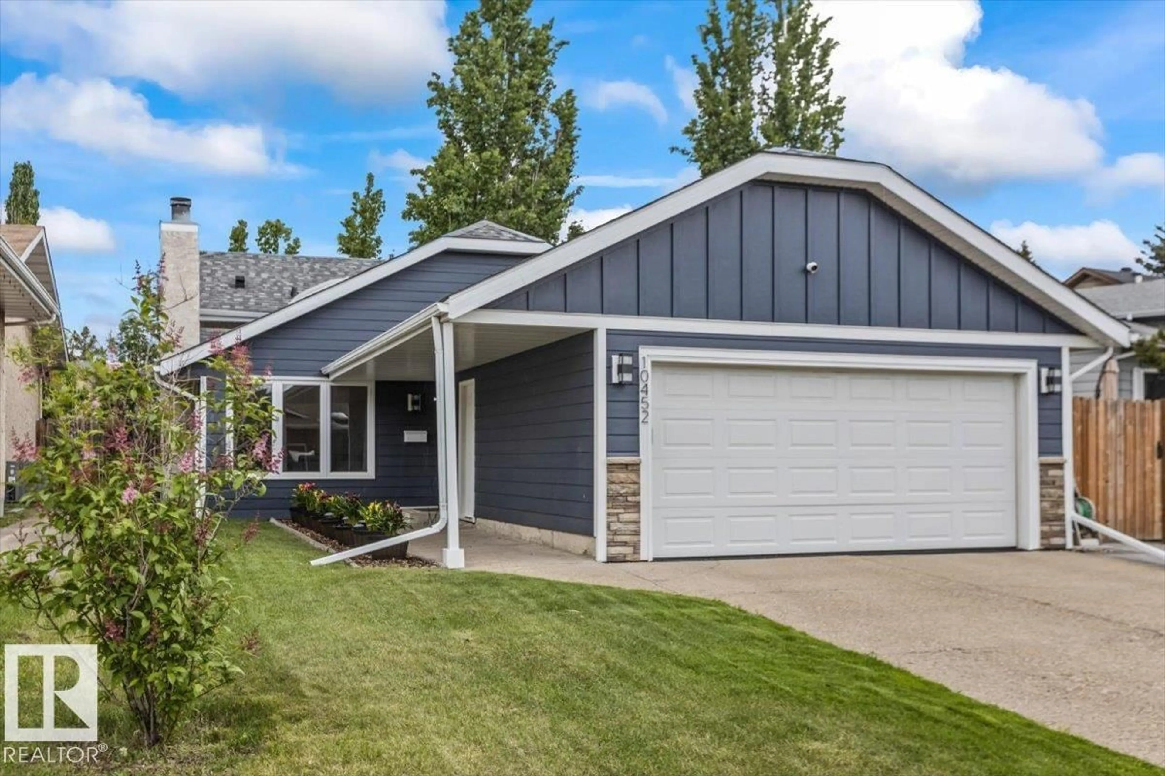 Home with vinyl exterior material, street for 10452 18 AV, Edmonton Alberta T6J4Z8
