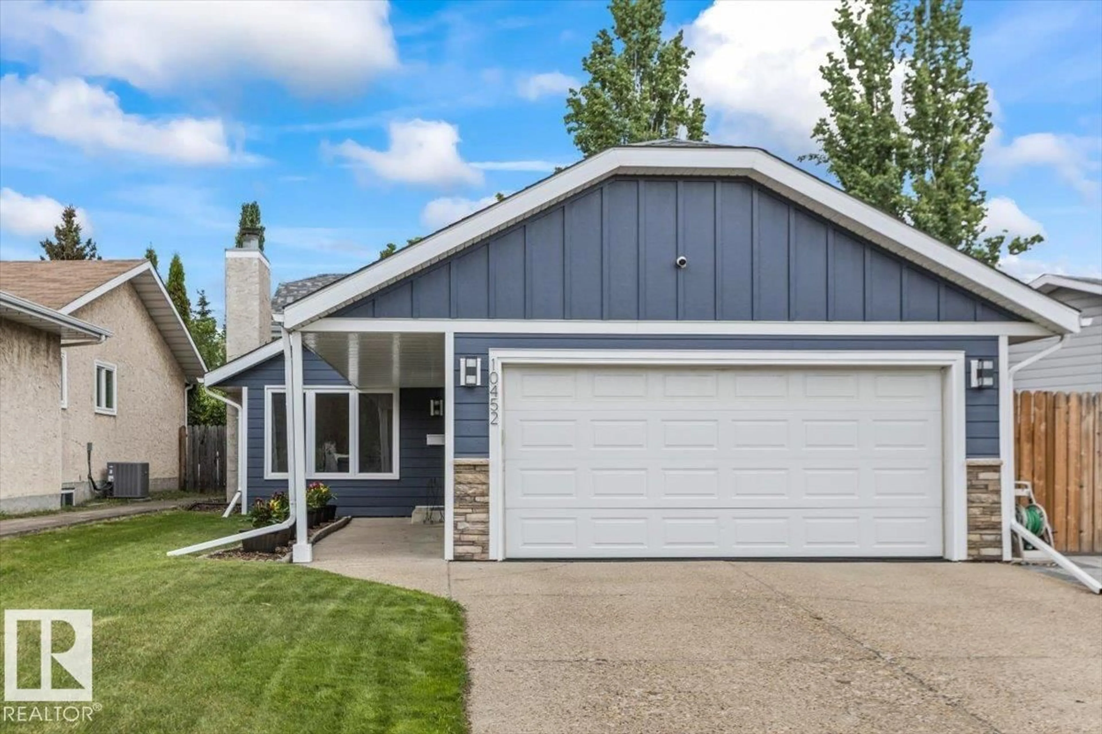 Home with vinyl exterior material, street for 10452 18 AV, Edmonton Alberta T6J4Z8