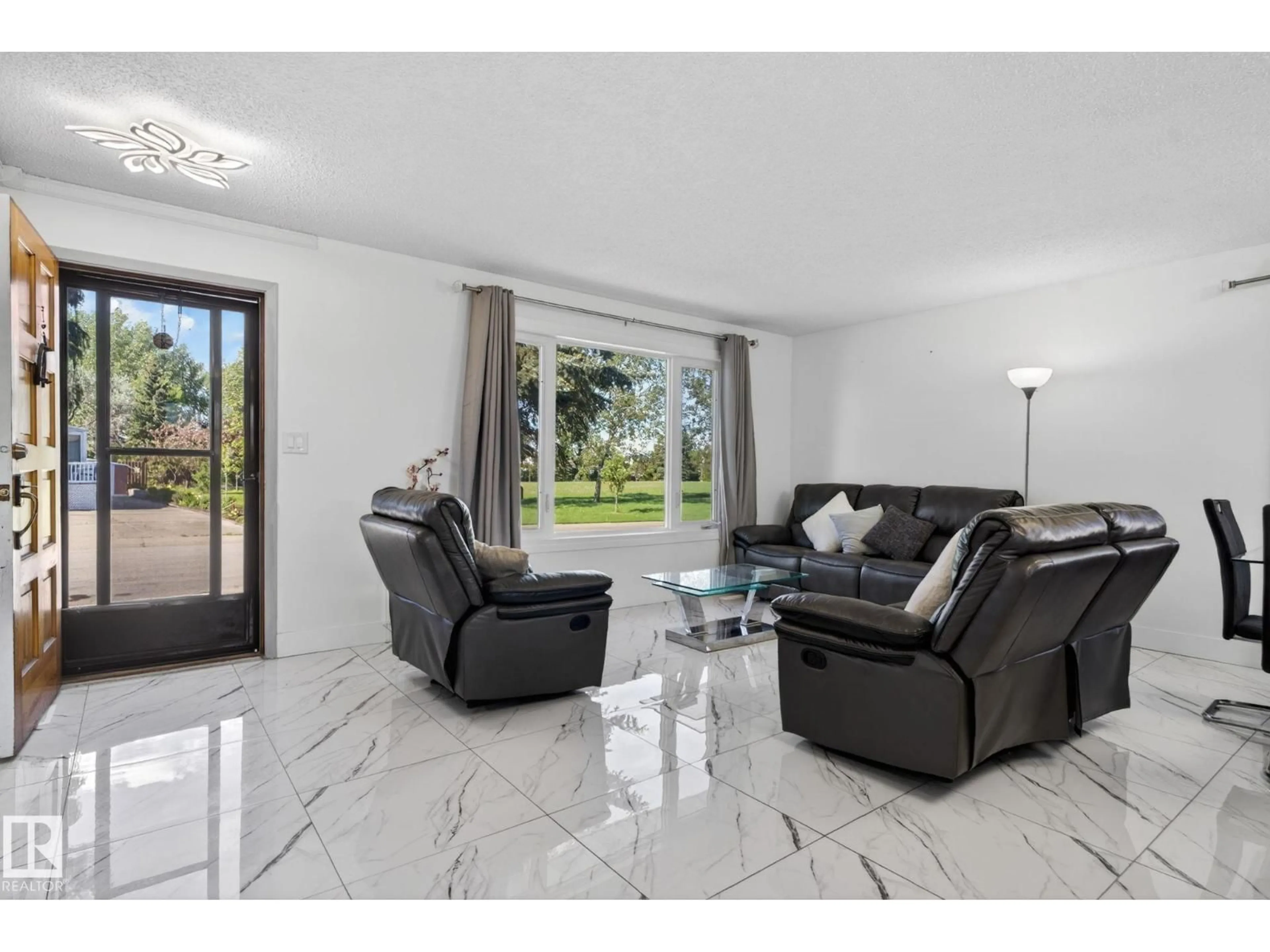 Living room with furniture, ceramic/tile floor for NW - 8835 152B AV, Edmonton Alberta T5E6G2