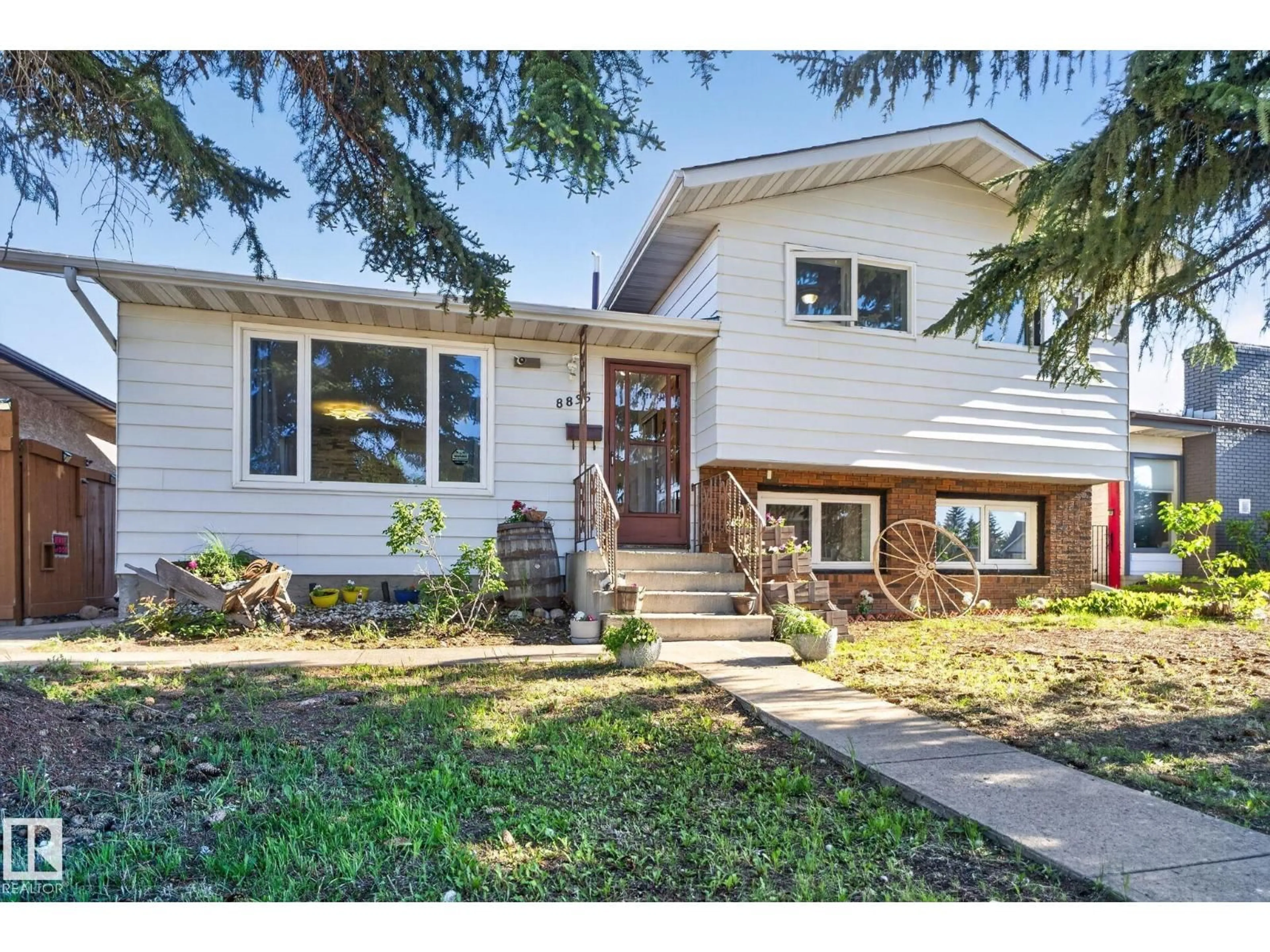 Home with vinyl exterior material, street for NW - 8835 152B AV, Edmonton Alberta T5E6G2