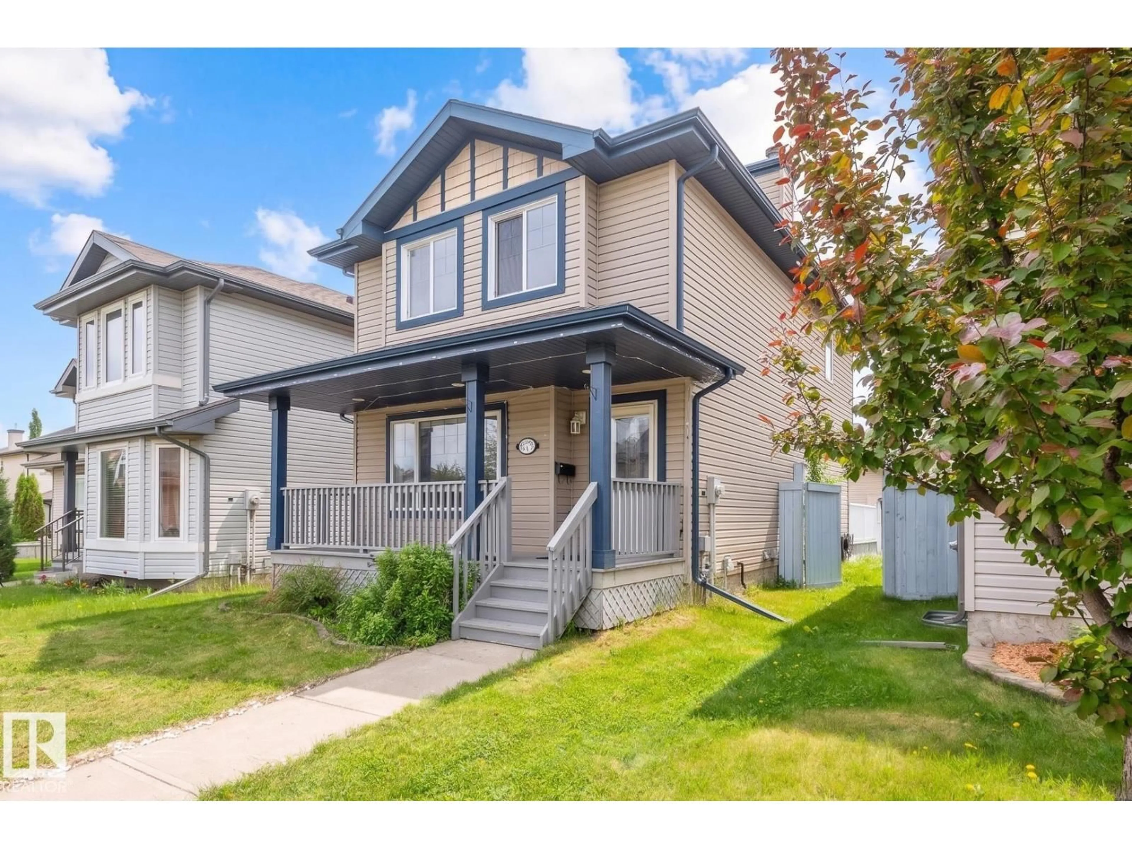 Home with vinyl exterior material, street for NW - 5919 203 ST, Edmonton Alberta T6M2Z3