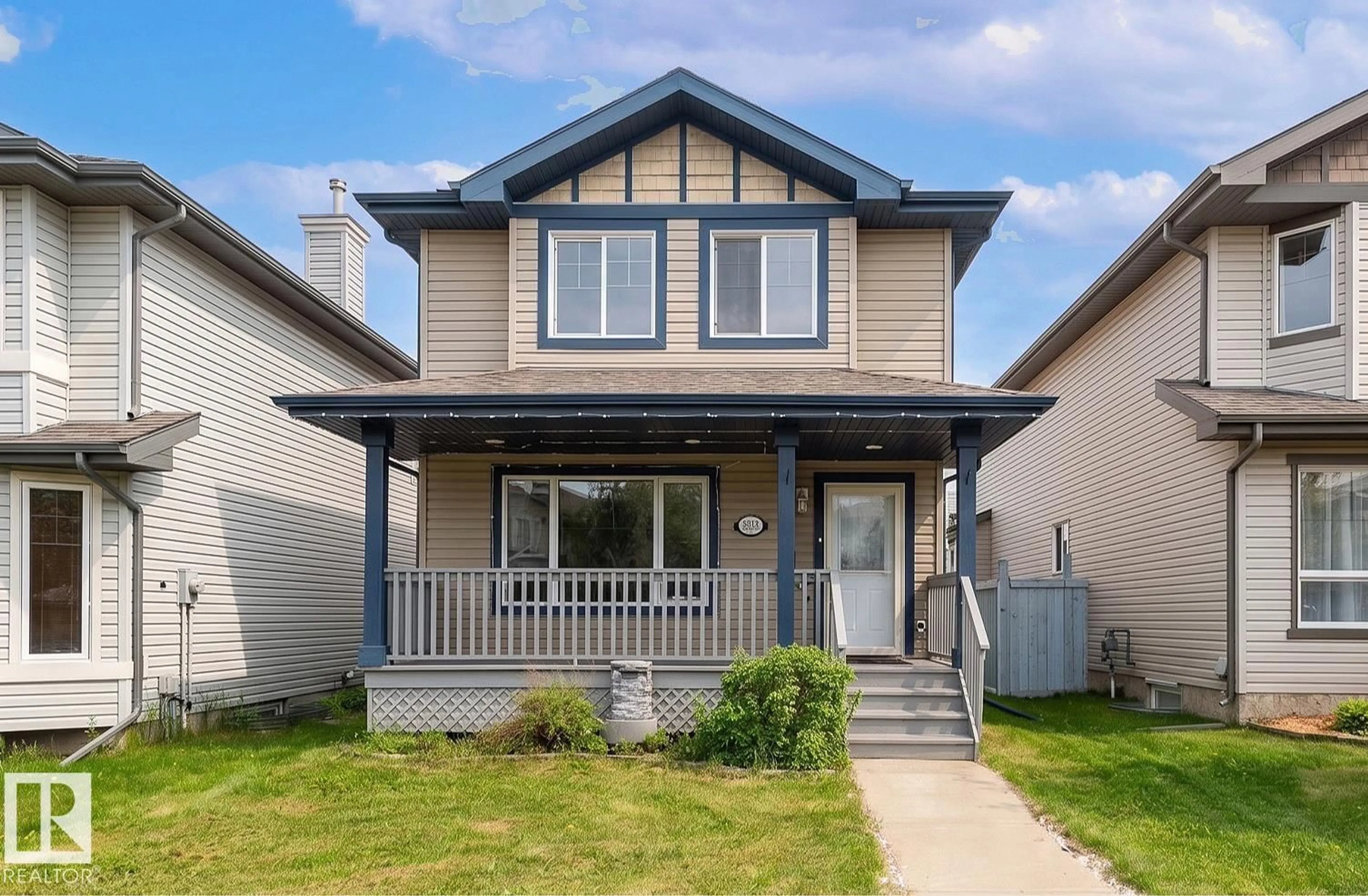 Home with vinyl exterior material, street for NW - 5919 203 ST, Edmonton Alberta T6M2Z3