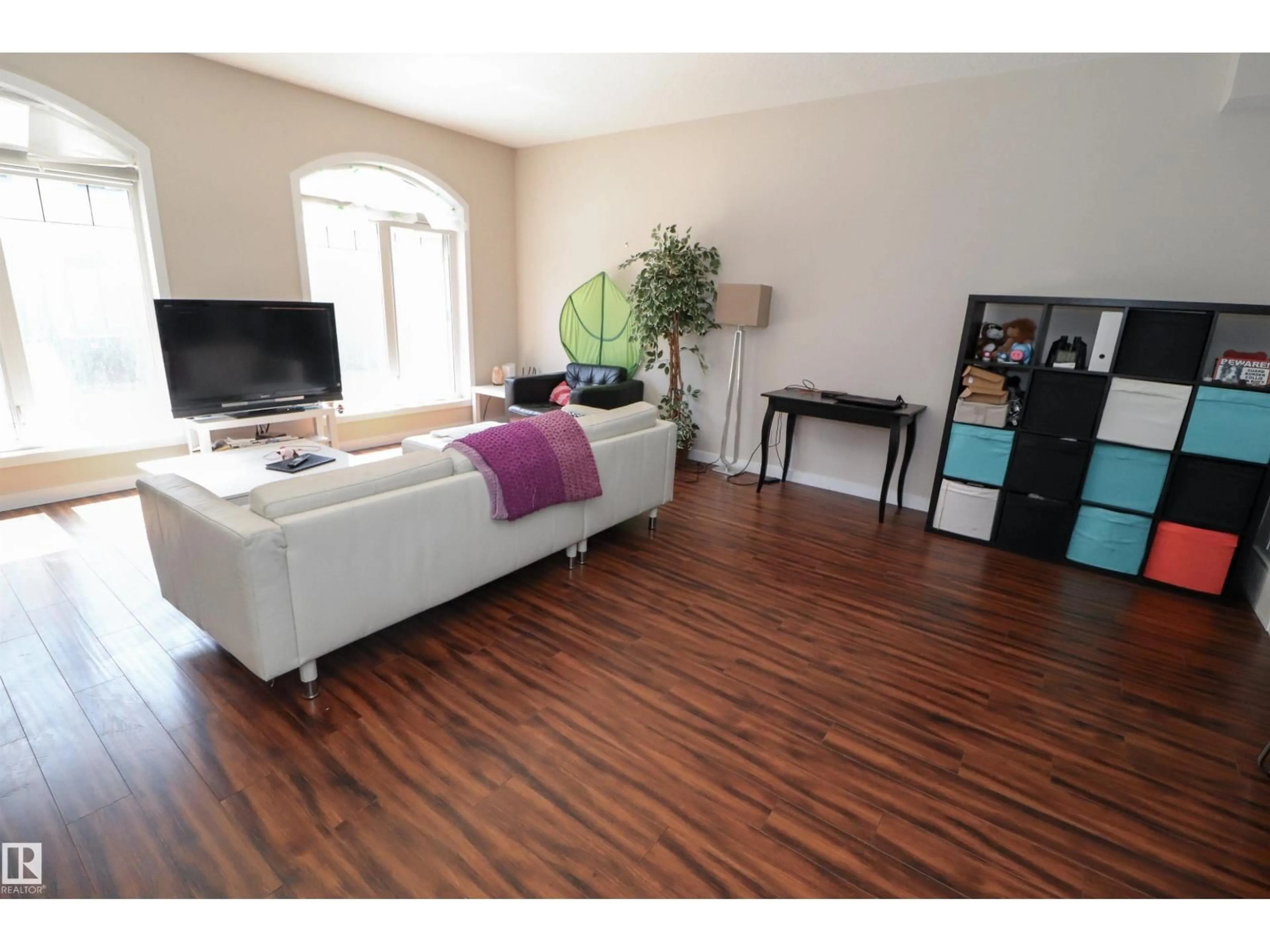 Living room with furniture, wood/laminate floor for #23 - 5873 MULLEN PL, Edmonton Alberta T6R0T5