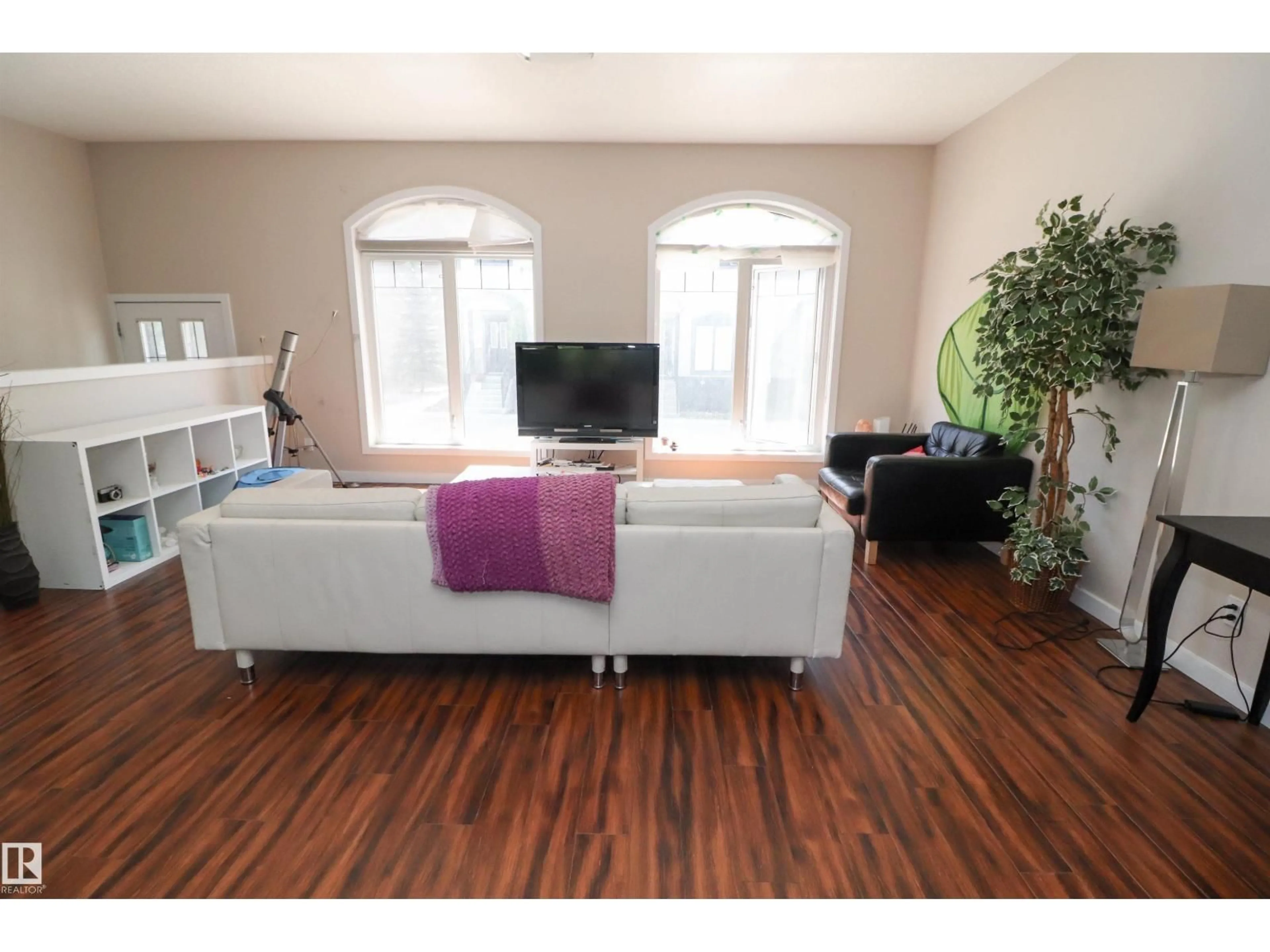Living room with furniture, wood/laminate floor for #23 - 5873 MULLEN PL, Edmonton Alberta T6R0T5