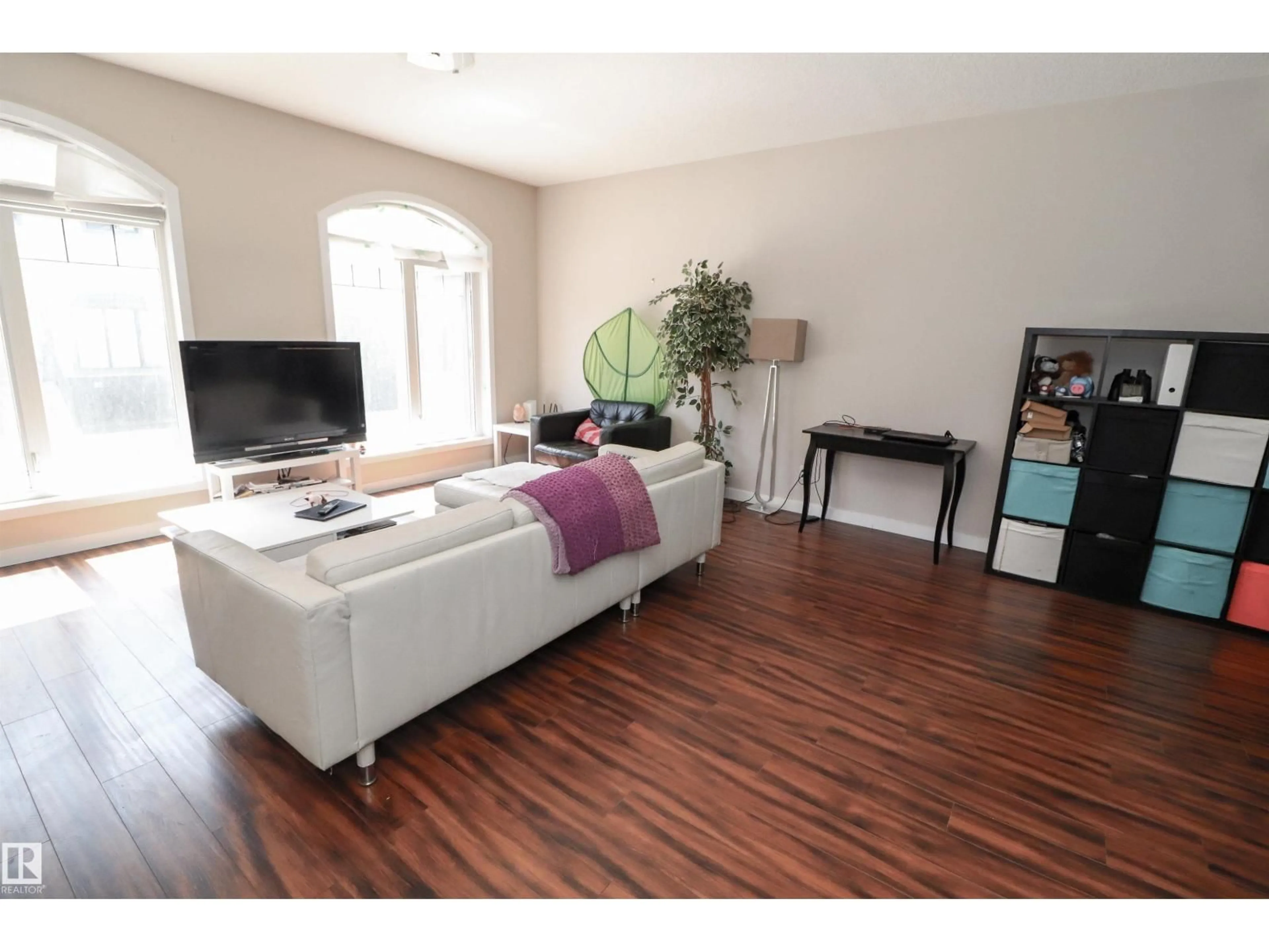 Living room with furniture, wood/laminate floor for #23 - 5873 MULLEN PL, Edmonton Alberta T6R0T5
