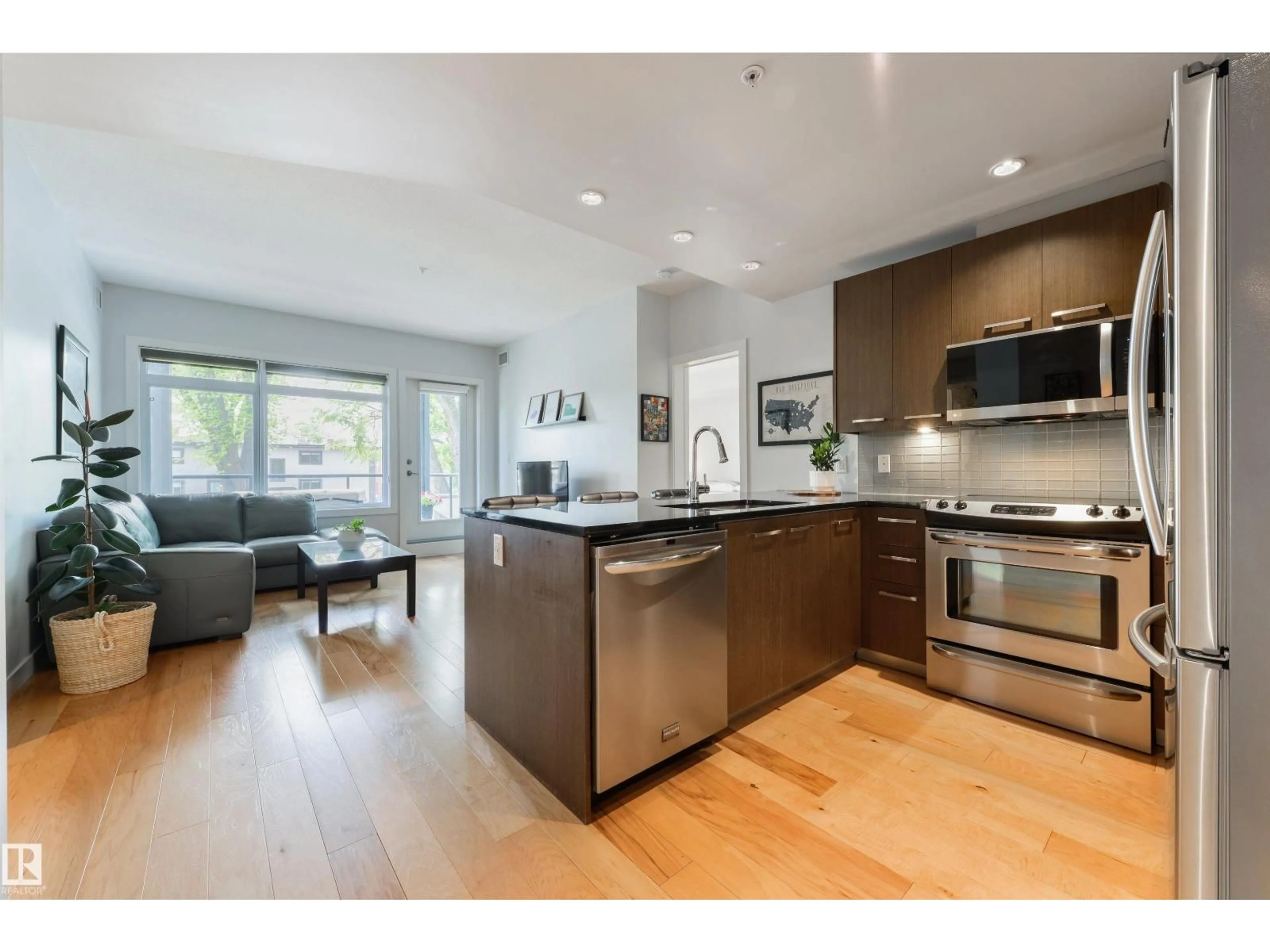 Open concept kitchen, wood/laminate floor for 205 - 9908 84 AV, Edmonton Alberta T6E2G3