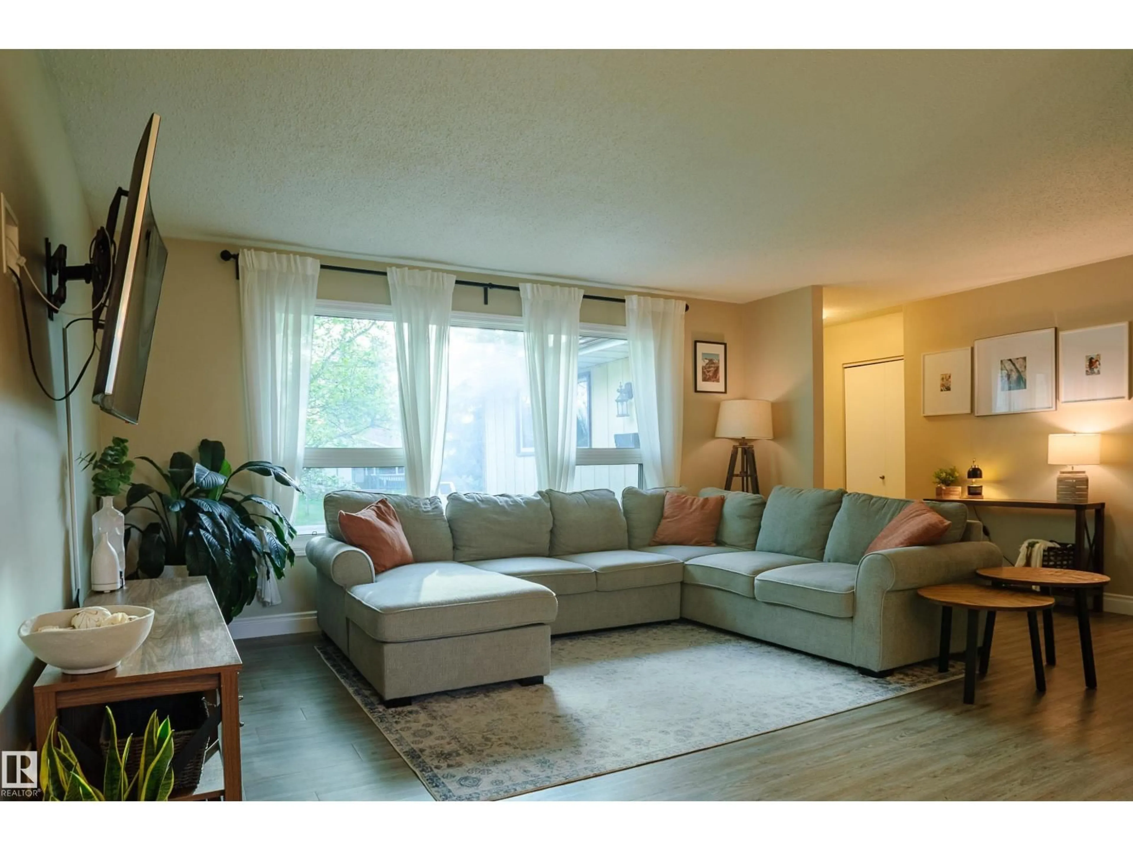 Living room with furniture, wood/laminate floor for 58 LODGEPOLE CR, St. Albert Alberta T8N2R7
