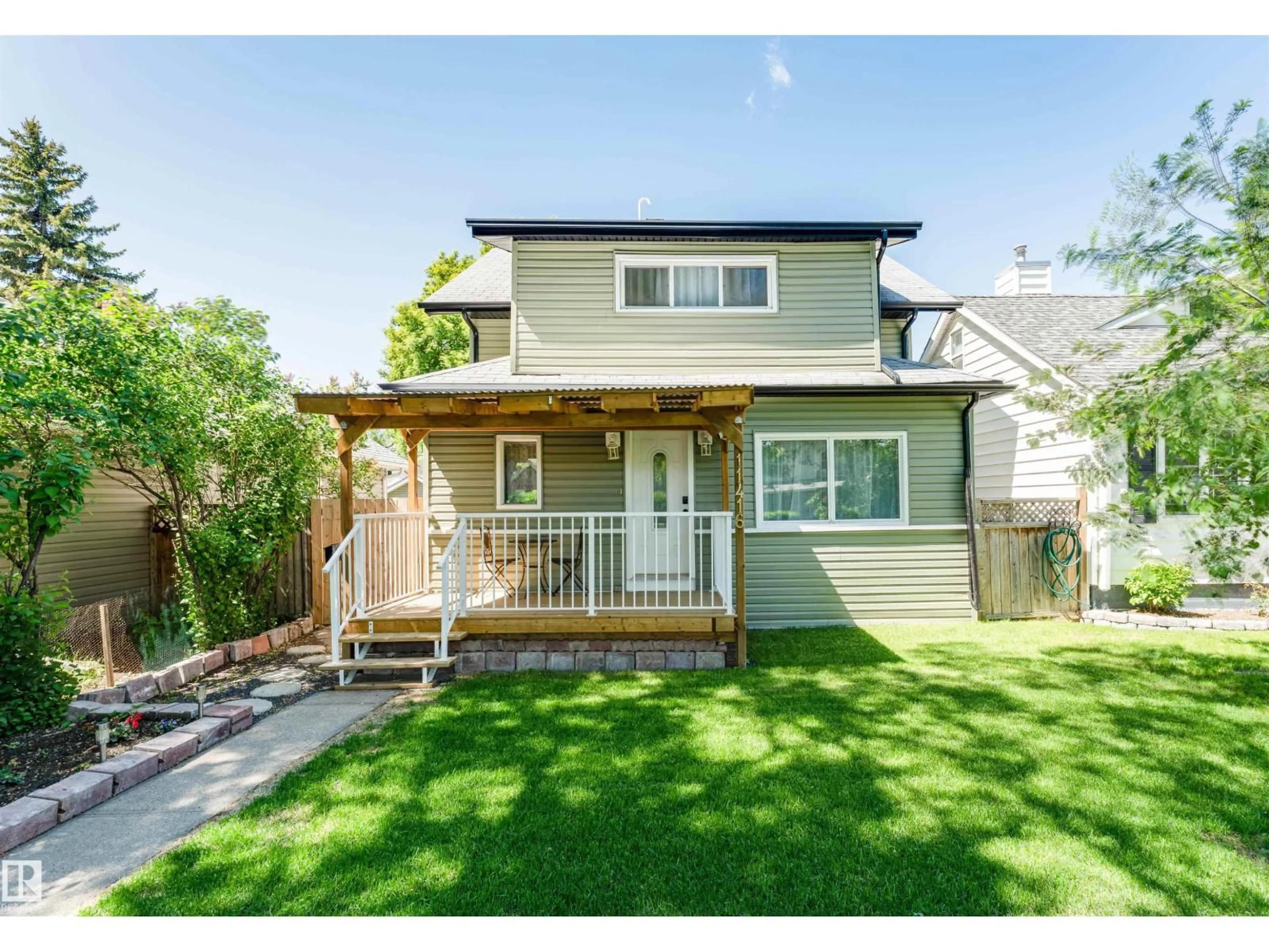 Home with vinyl exterior material, street for NW - 11416 89 ST, Edmonton Alberta T5B3T8