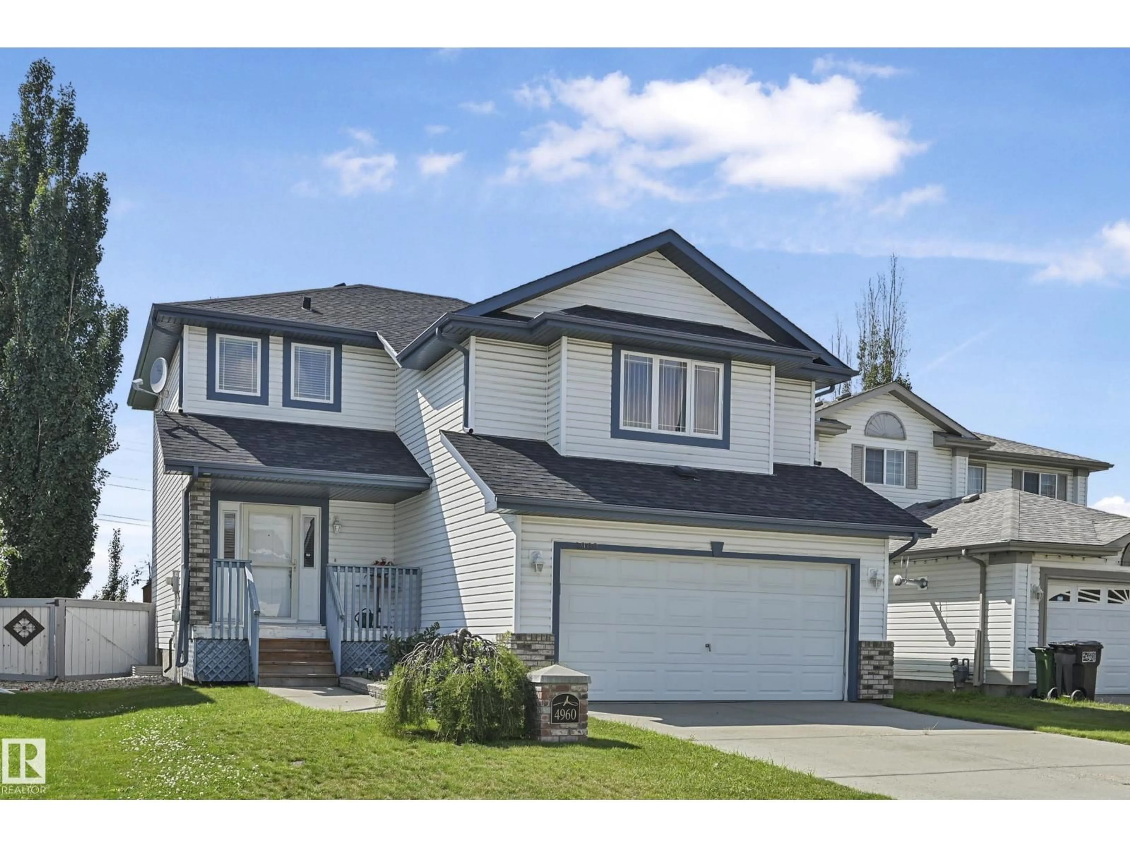 Home with vinyl exterior material, street for NW - 4960 191 ST, Edmonton Alberta T6M2T8