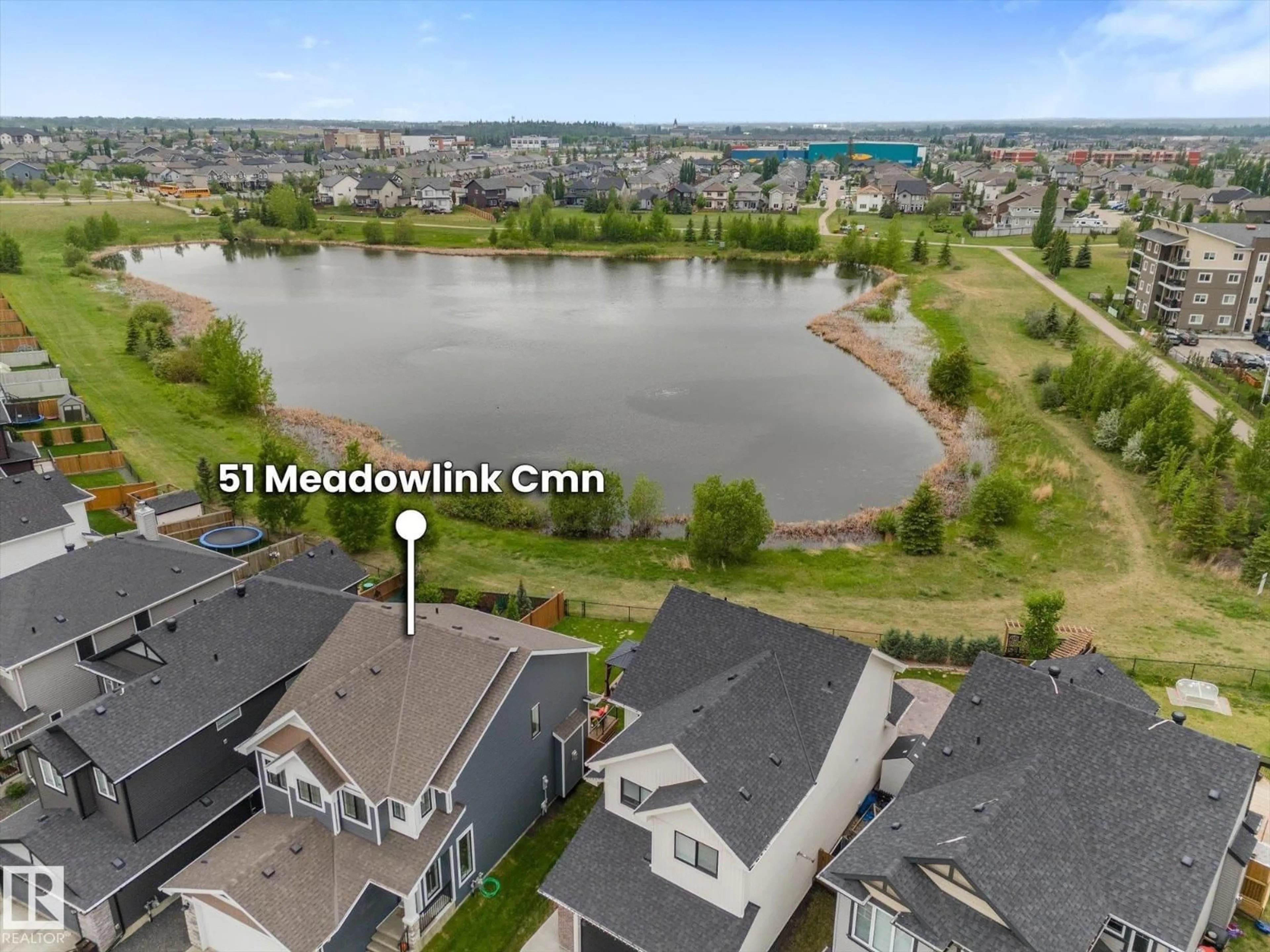 A pic from outside/outdoor area/front of a property/back of a property/a pic from drone, water/lake/river/ocean view for 51 MEADOWLINK CM, Spruce Grove Alberta T7X0P3