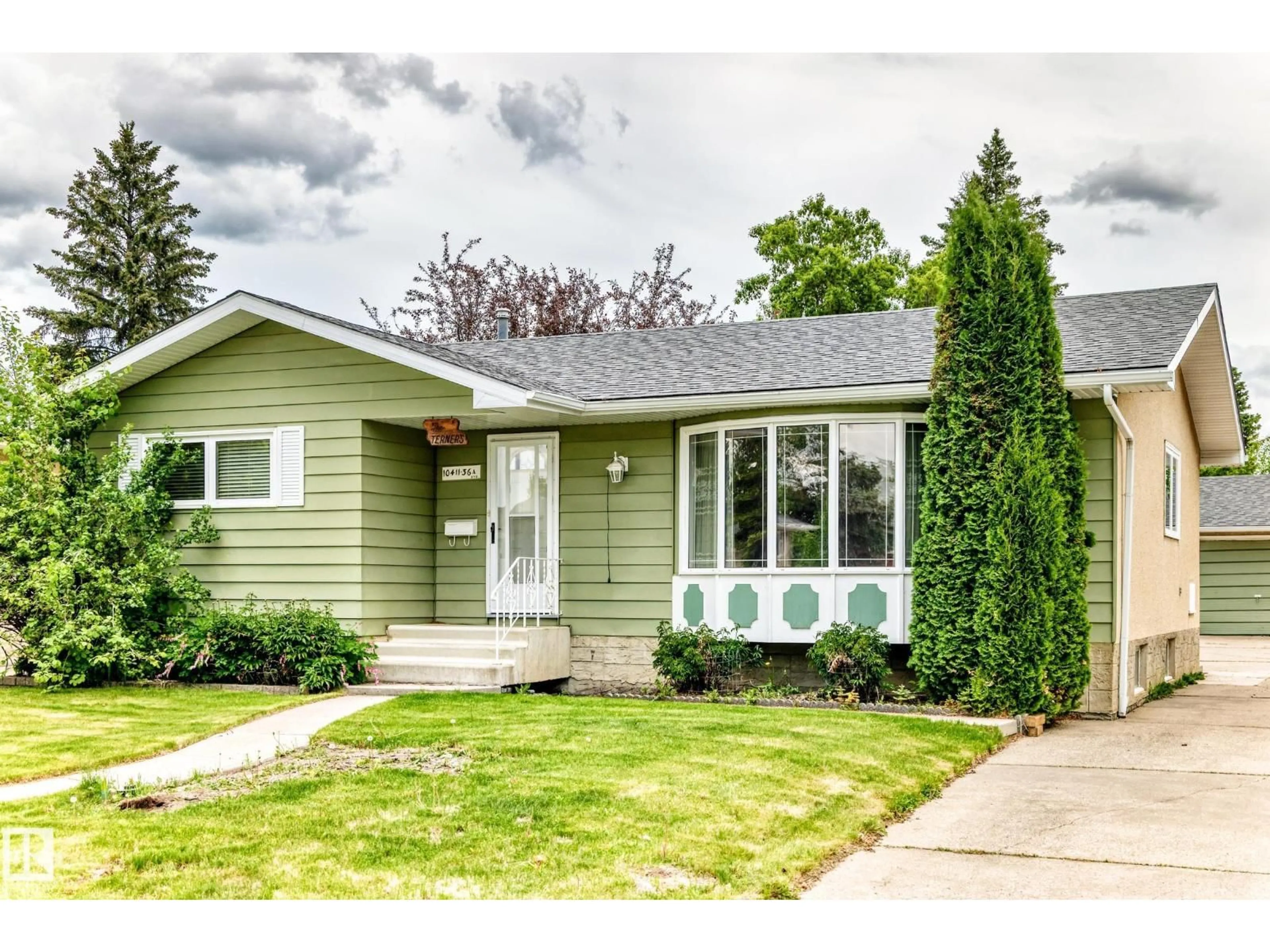 Home with vinyl exterior material, street for 10411 36A AV, Edmonton Alberta T6J2H7