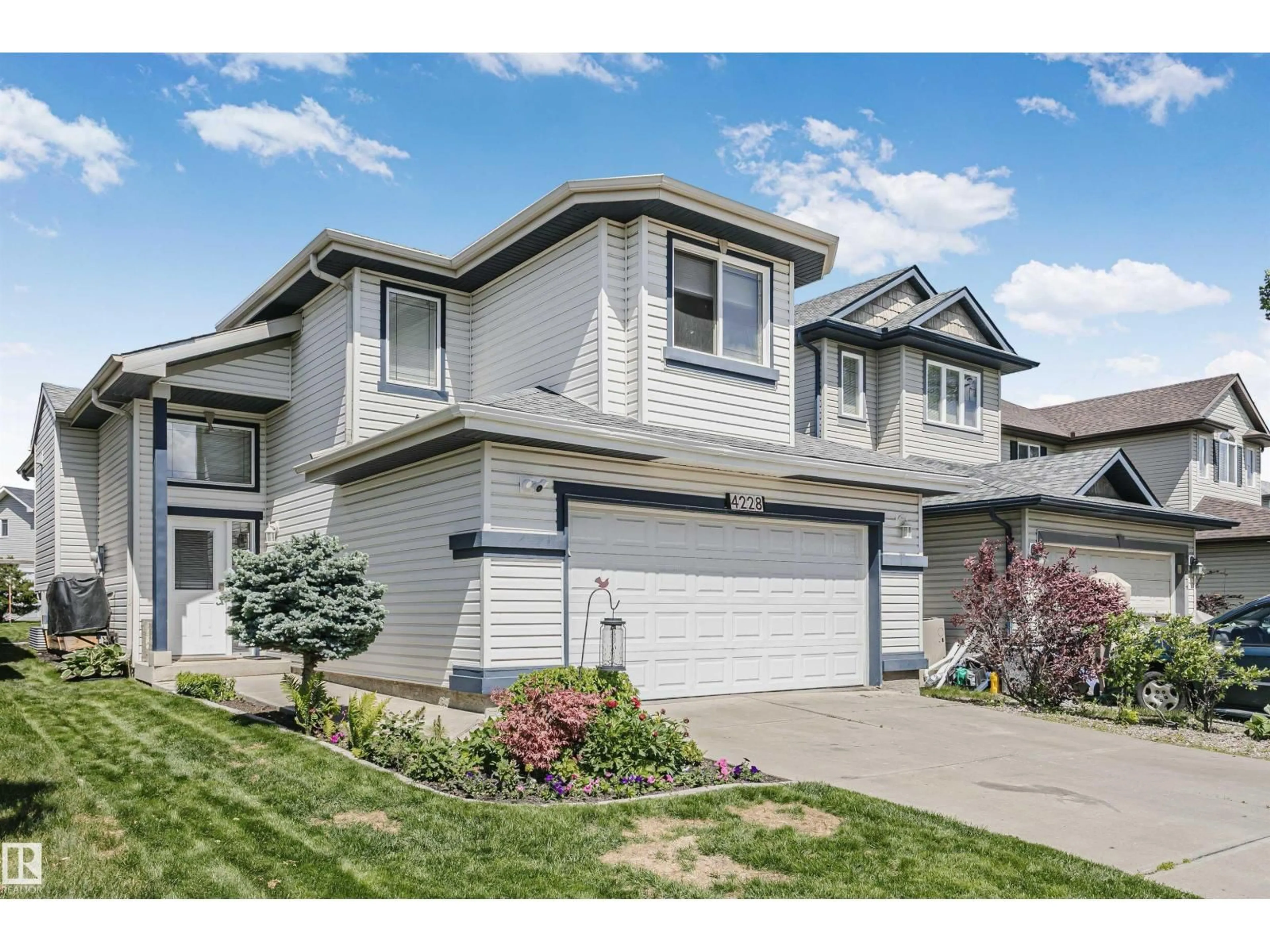 Home with vinyl exterior material, street for 4228 162 AV, Edmonton Alberta T5Y0H8