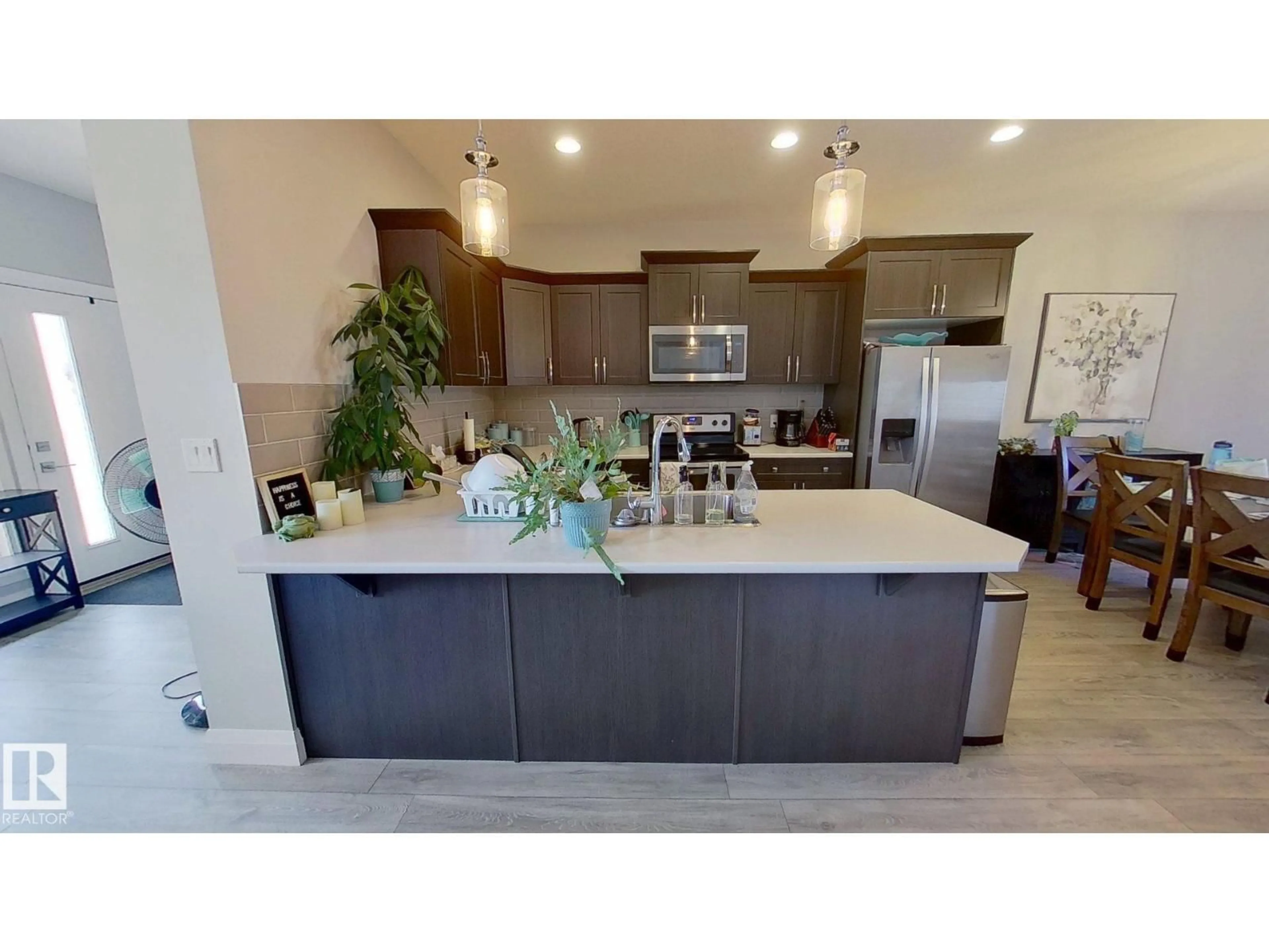 Open concept kitchen, ceramic/tile floor for 3632 8 AV, Edmonton Alberta T6X2G6