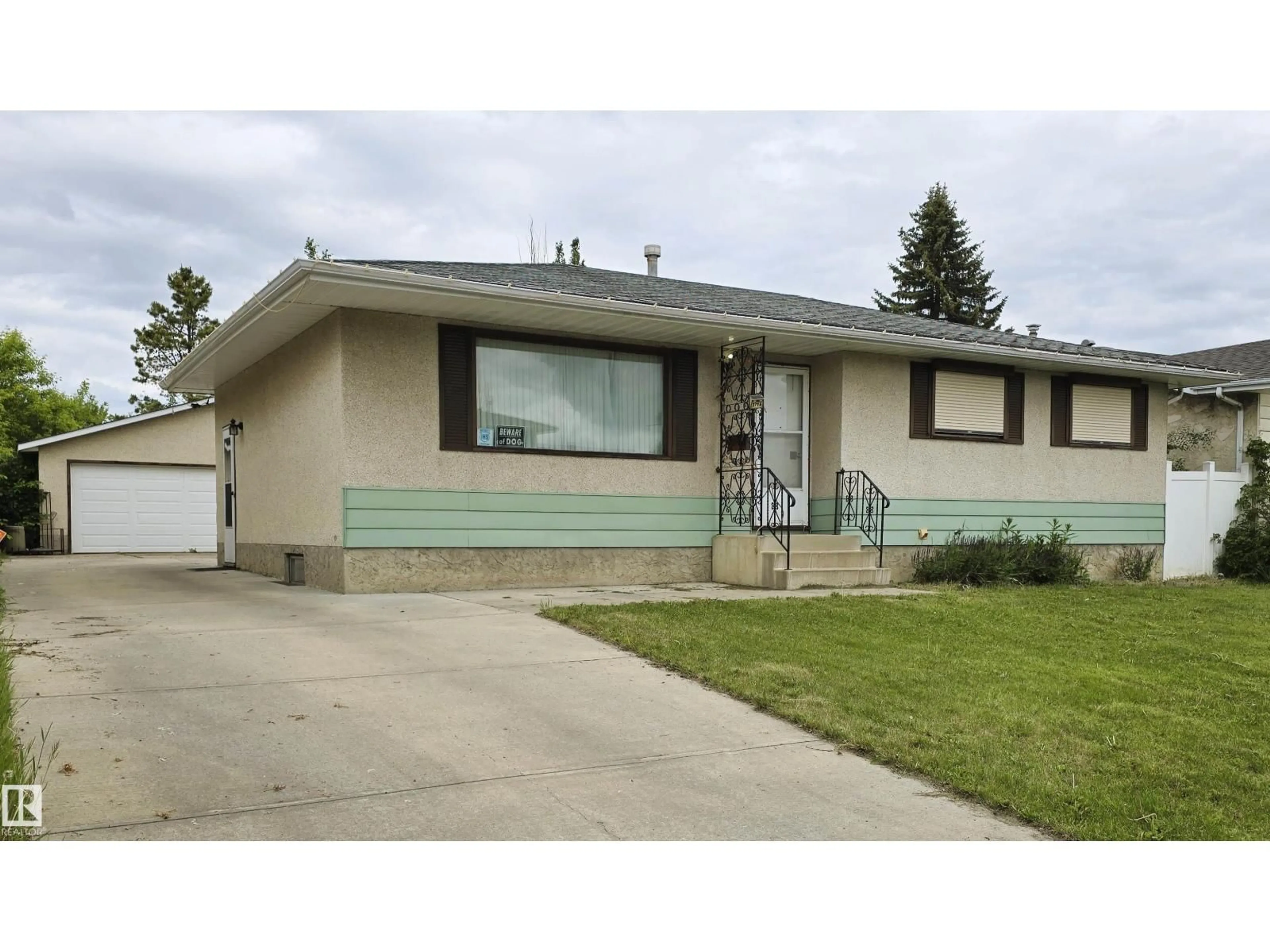 Home with vinyl exterior material, street for NW - 3718 136A AV, Edmonton Alberta T5A2P4