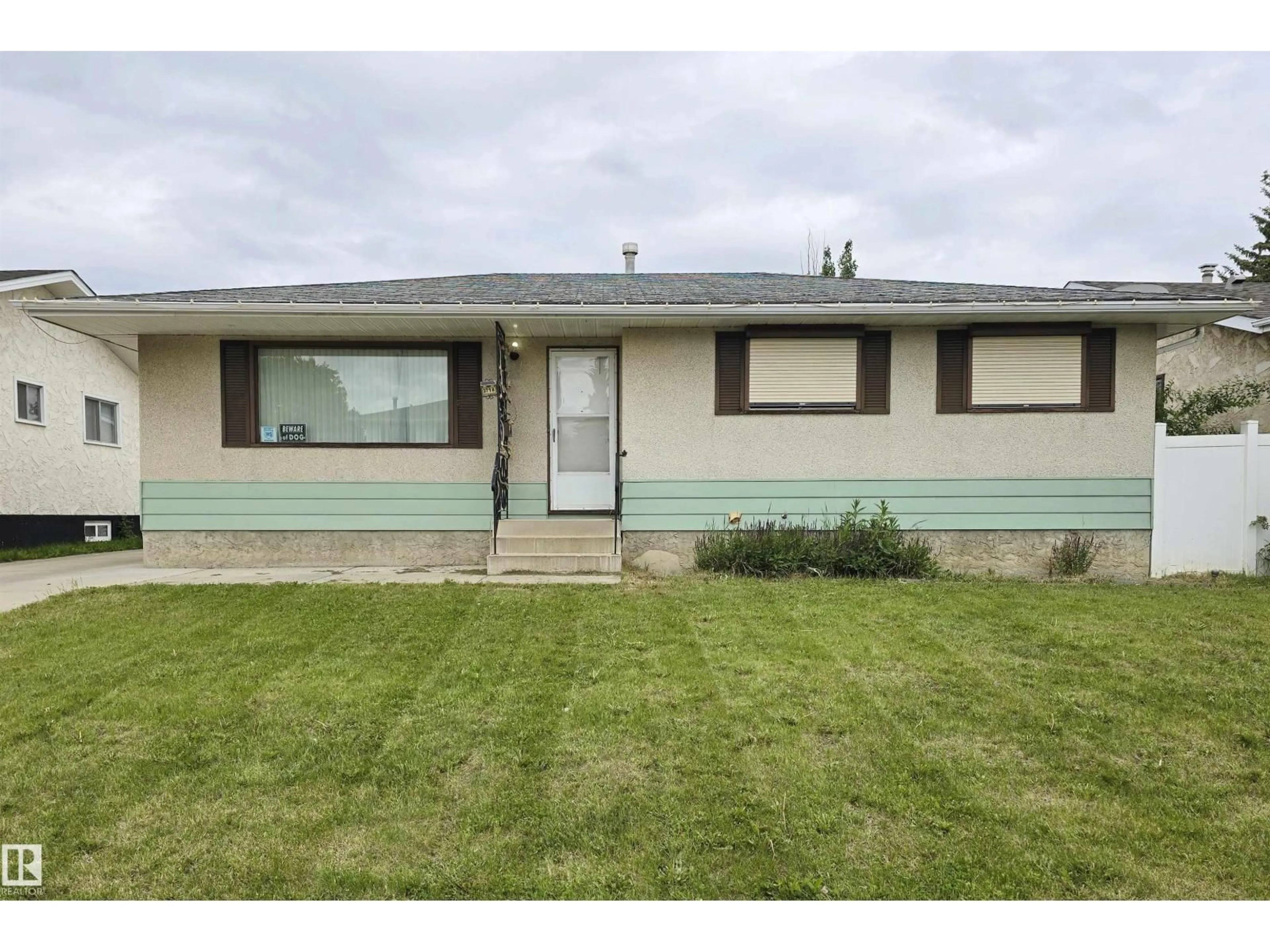 Home with vinyl exterior material, street for NW - 3718 136A AV, Edmonton Alberta T5A2P4