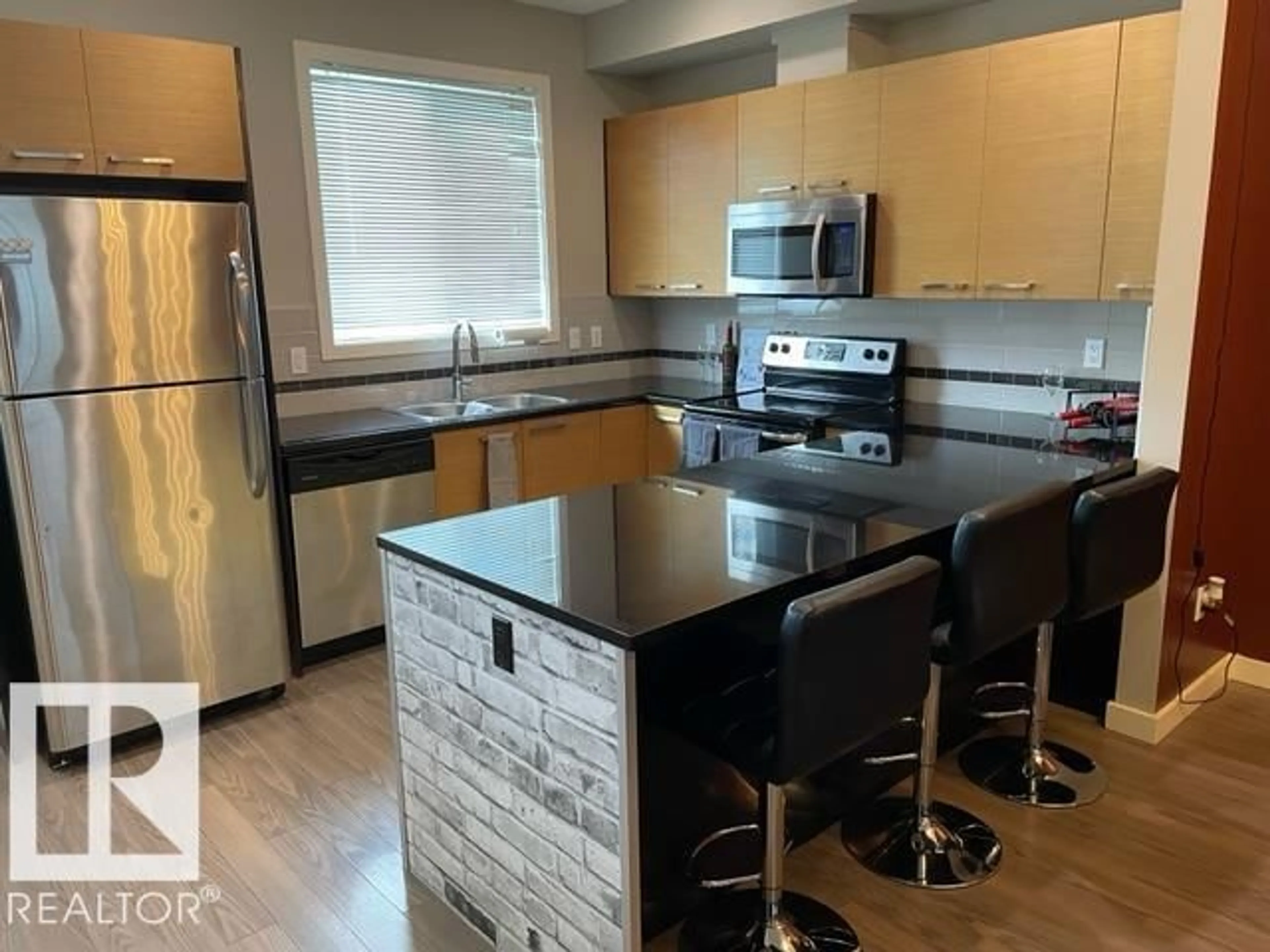 Open concept kitchen, wood/laminate floor for SW - 62 675 WATT BV, Edmonton Alberta T6X0Y2