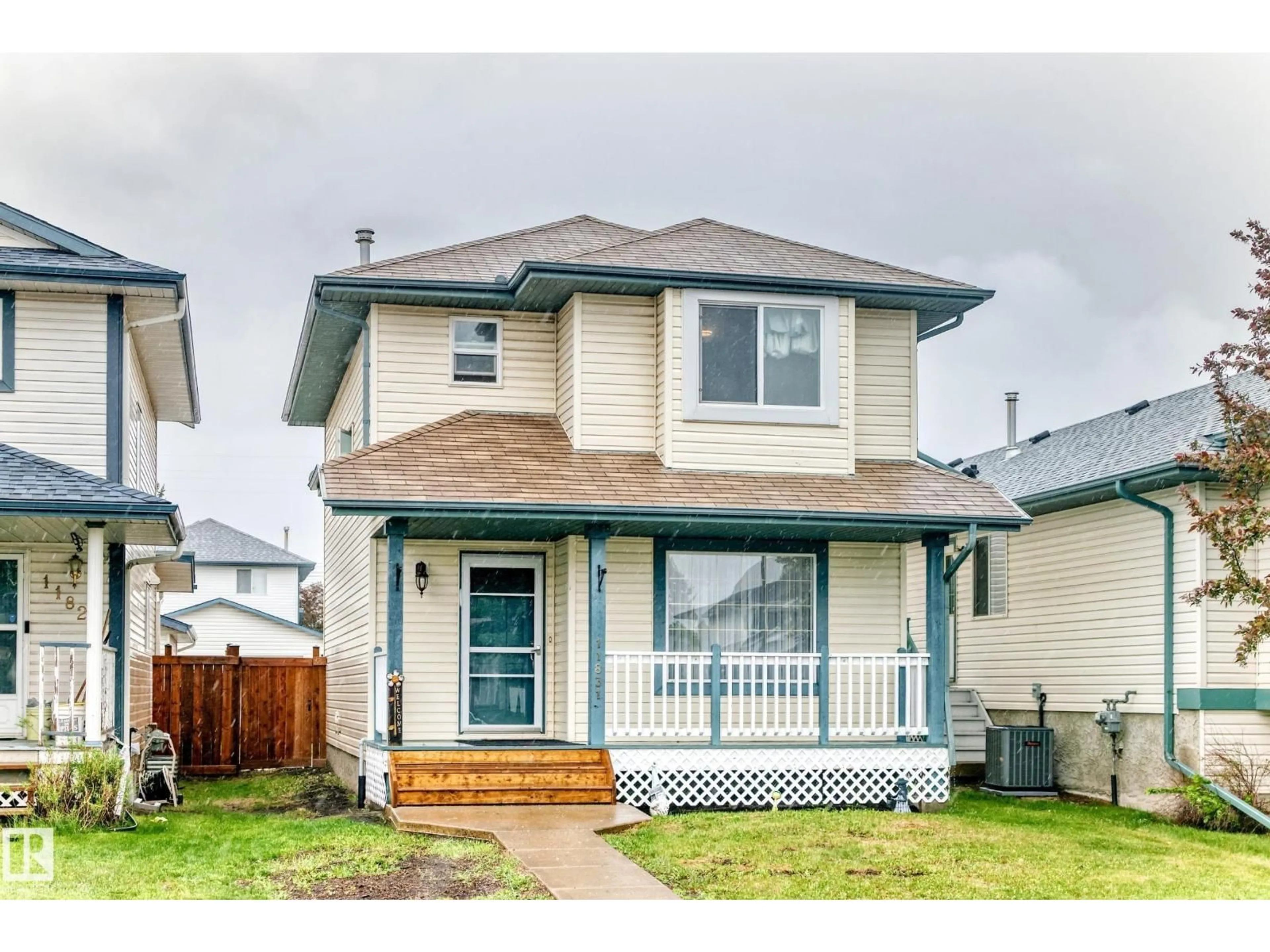 Home with vinyl exterior material, street for 11831 9 AV, Edmonton Alberta T6J7A1