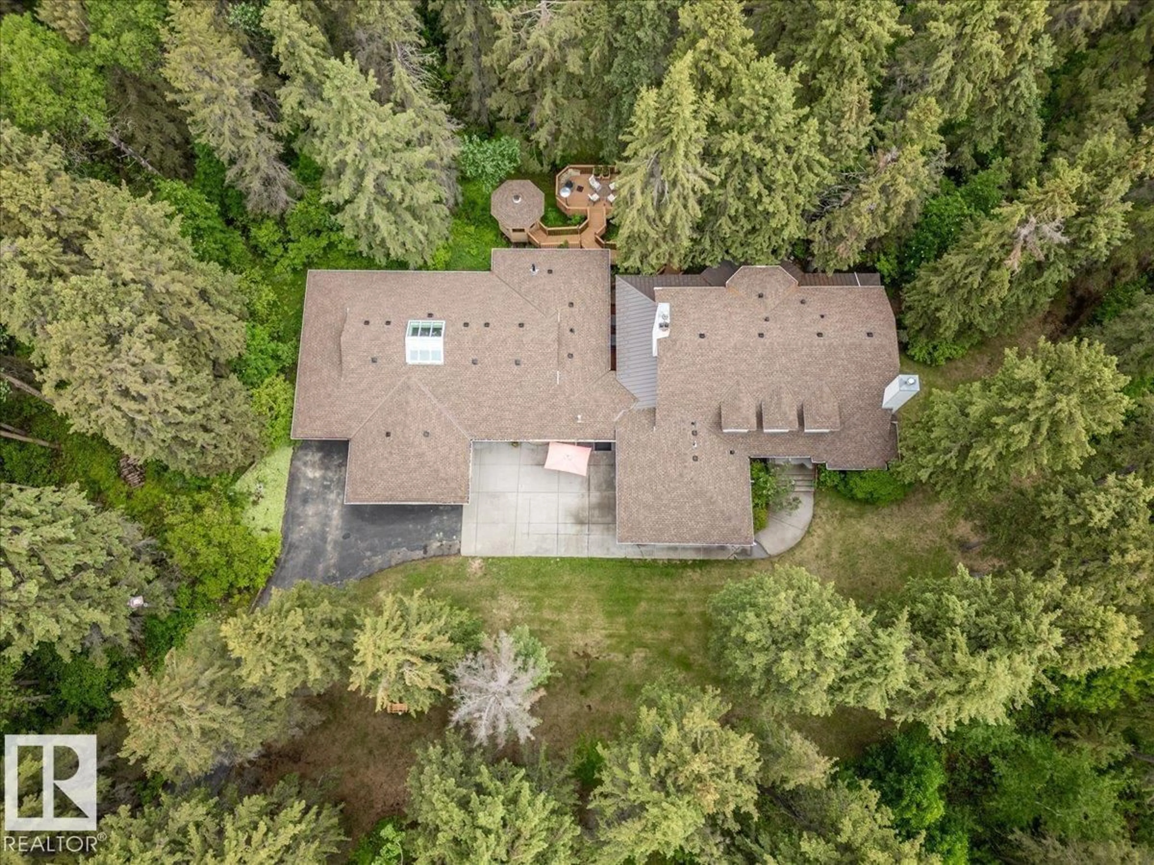 A pic from outside/outdoor area/front of a property/back of a property/a pic from drone, forest/trees view for #104 - 244013 TWP ROAD 470, Rural Wetaskiwin County Alberta T9A1W8