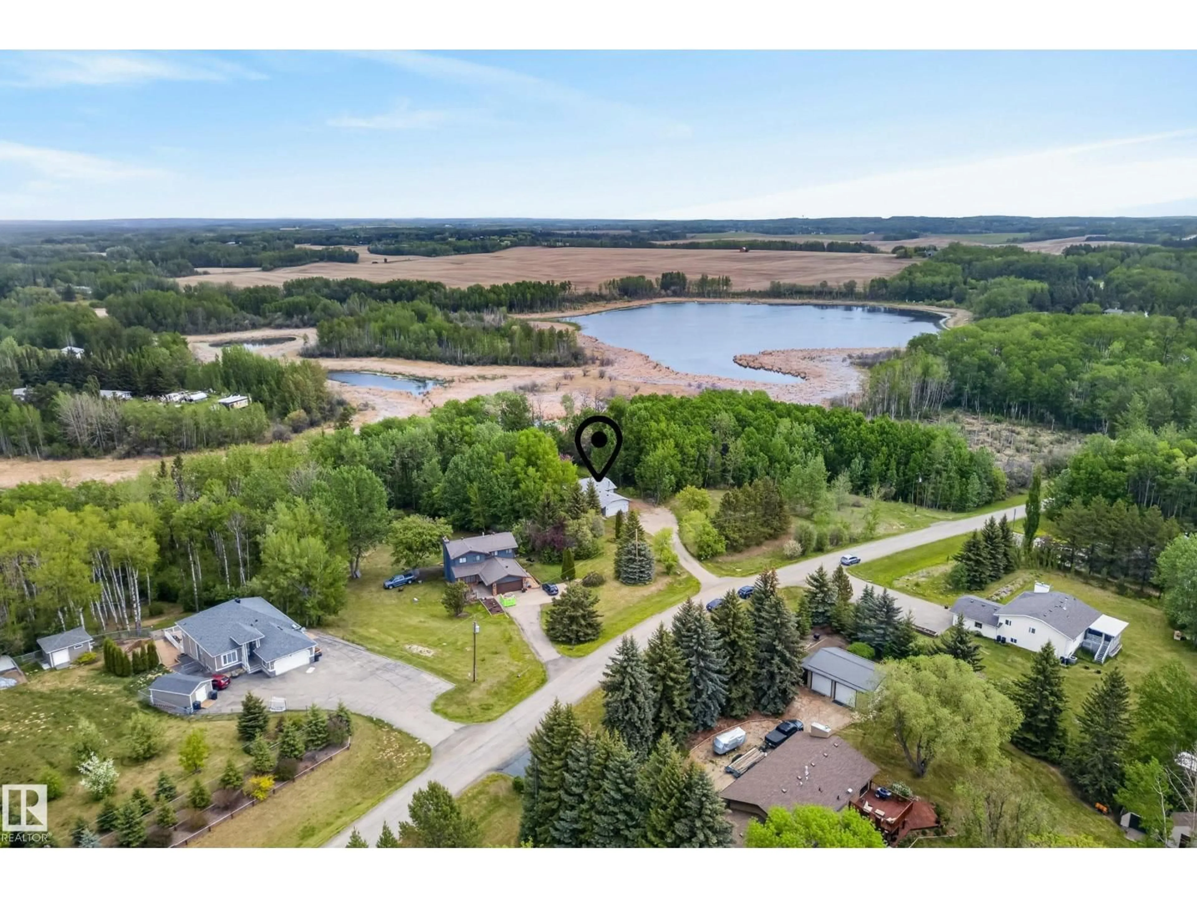 A pic from outside/outdoor area/front of a property/back of a property/a pic from drone, water/lake/river/ocean view for #21 - 2228 PARKLAND DR, Rural Parkland County Alberta T7Y2L2