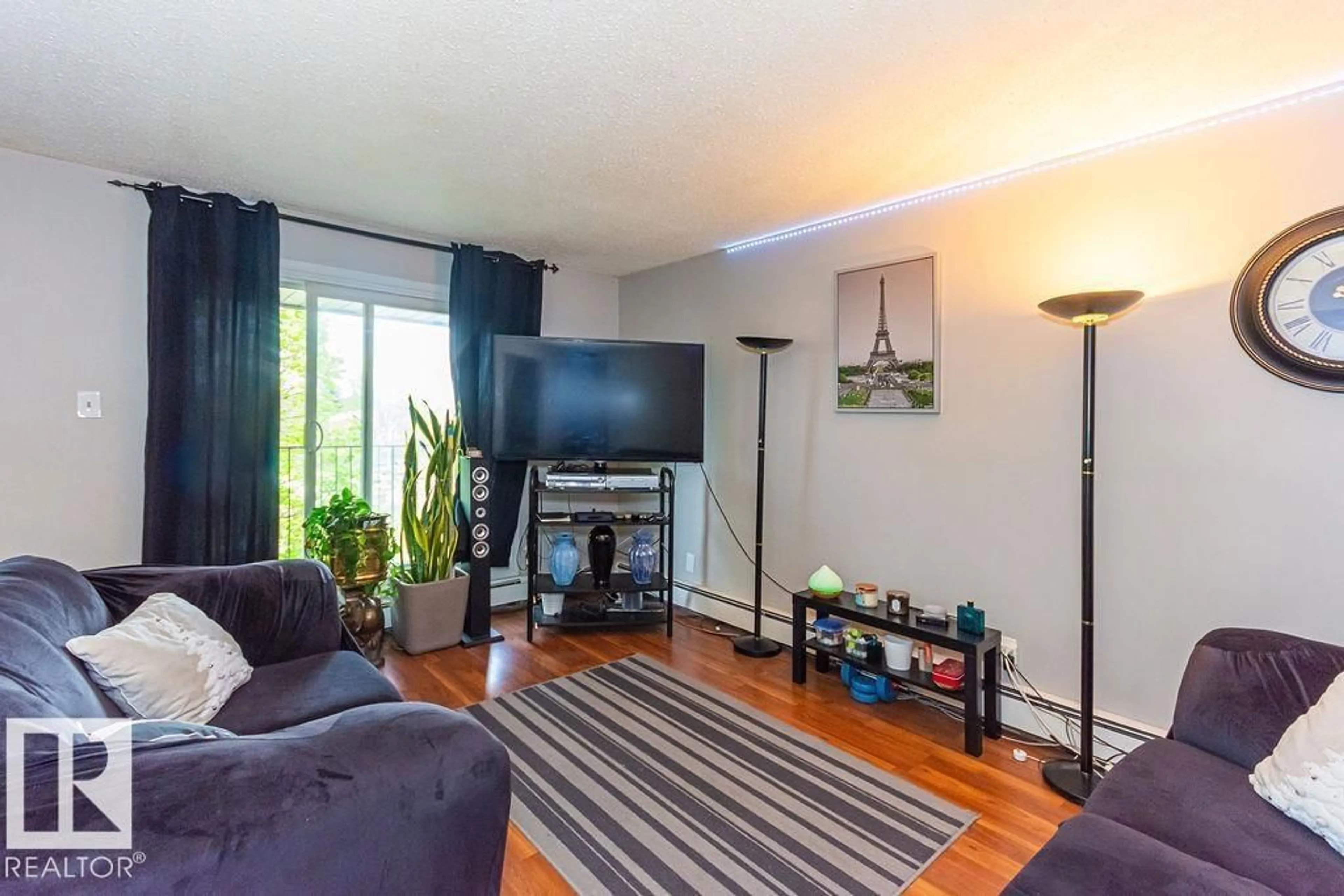 Living room with furniture, wood/laminate floor for #6 - 3819 76 ST NW, Edmonton Alberta T6K2P9