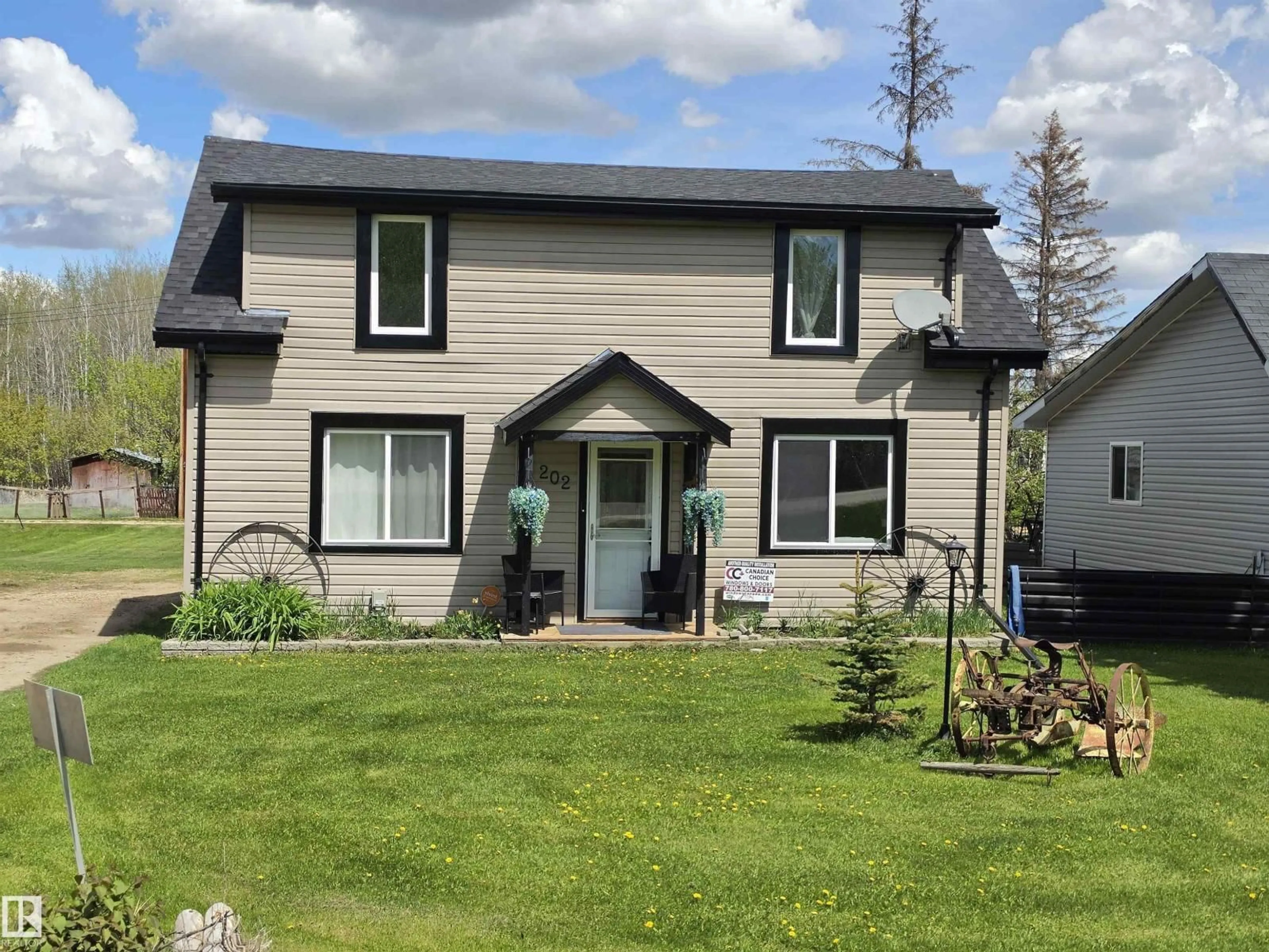 Home with vinyl exterior material, street for 202 RGE ROAD 53, Cherhill Alberta T0E0J0
