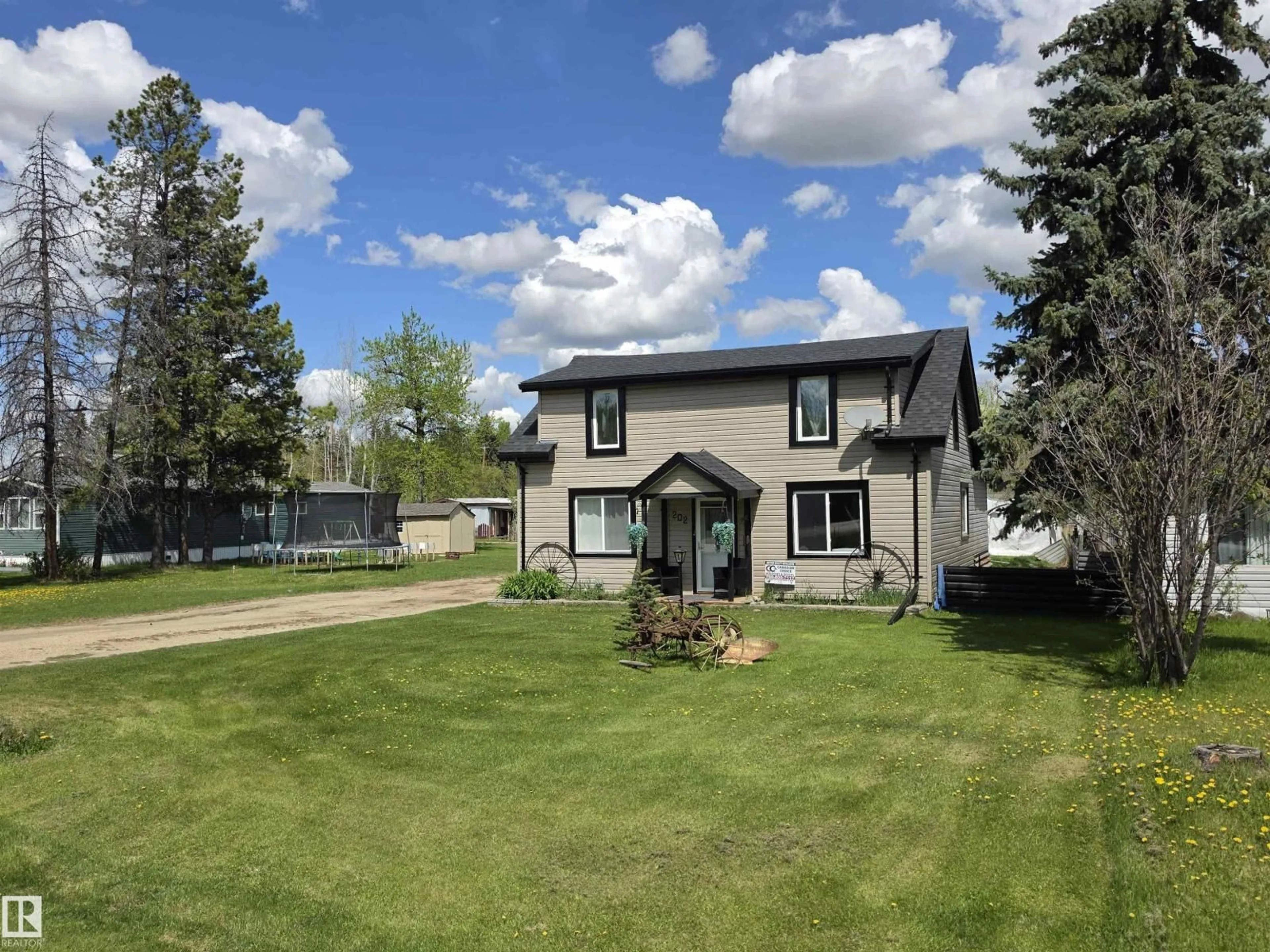 A pic from outside/outdoor area/front of a property/back of a property/a pic from drone, street for 202 RGE ROAD 53, Cherhill Alberta T0E0J0