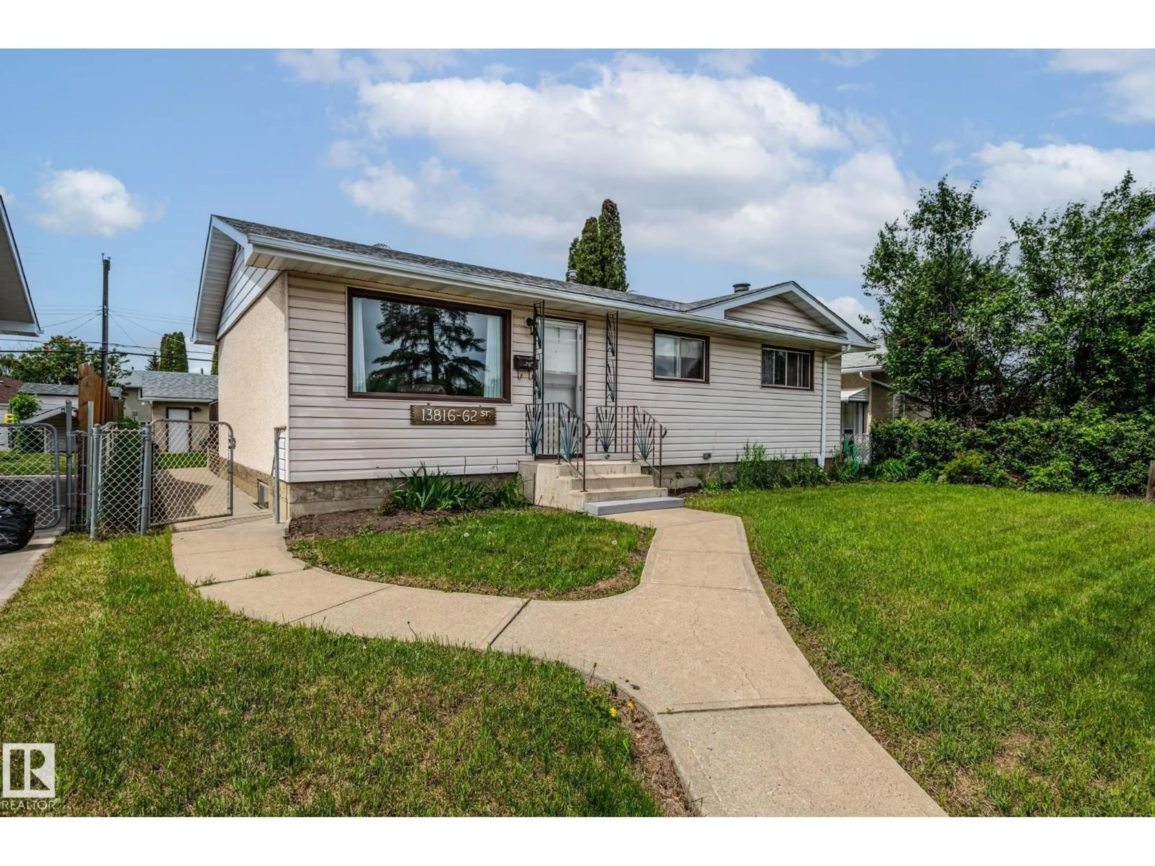 Home with vinyl exterior material, street for NW - 13816 62 ST, Edmonton Alberta T5A1P7