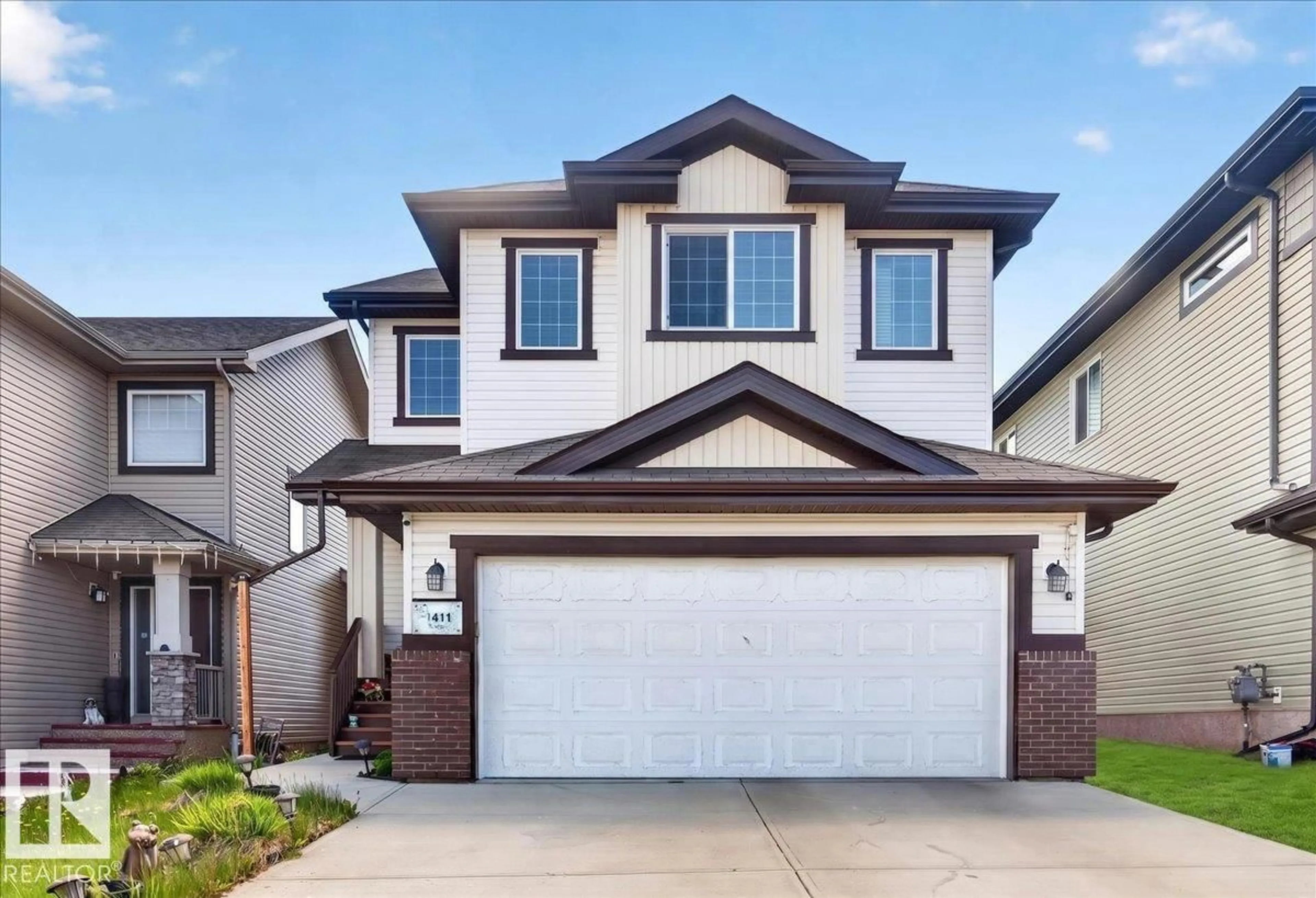 Home with vinyl exterior material, street for 1411 30 AV, Edmonton Alberta T6T0V7