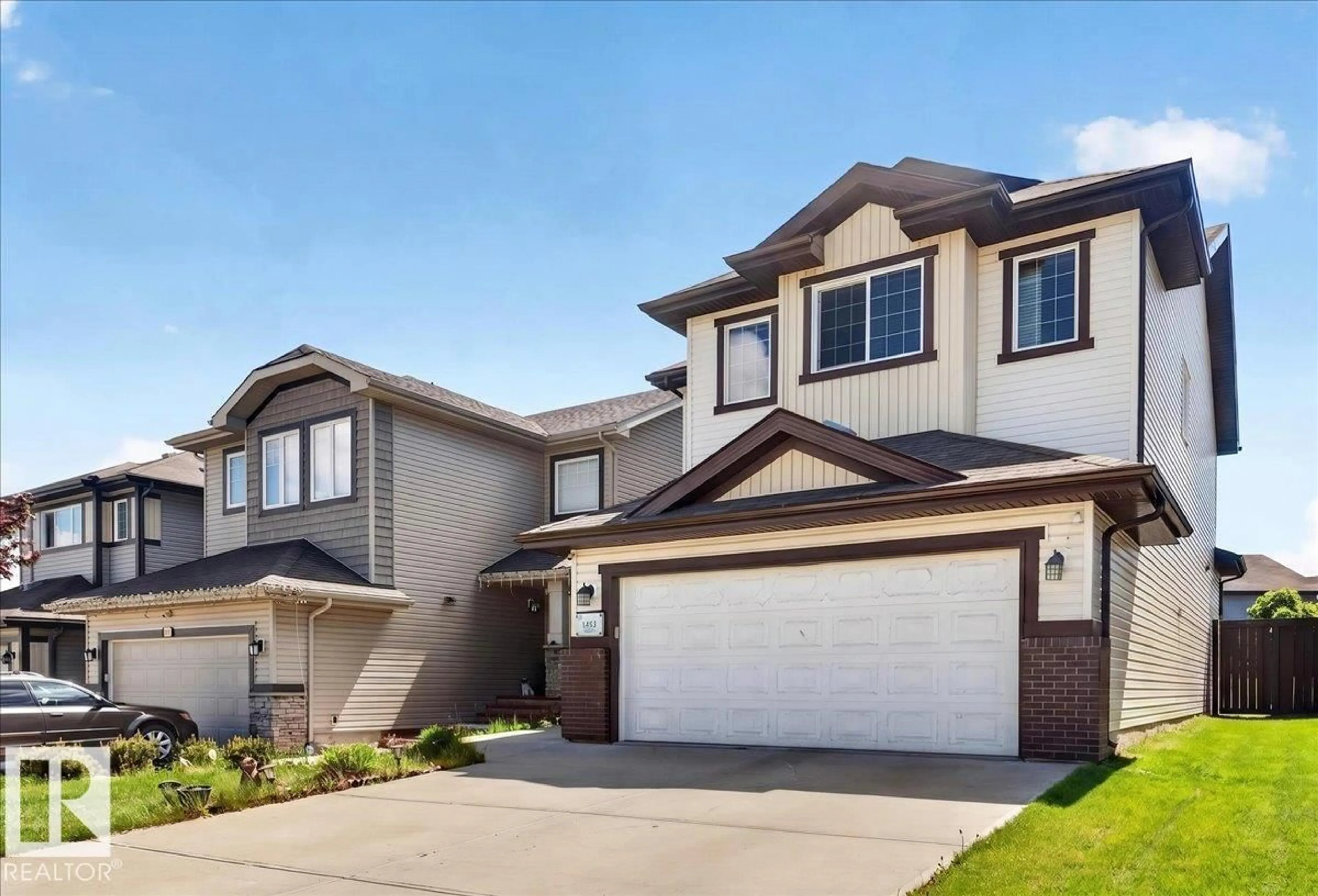 Home with vinyl exterior material, street for 1411 30 AV, Edmonton Alberta T6T0V7