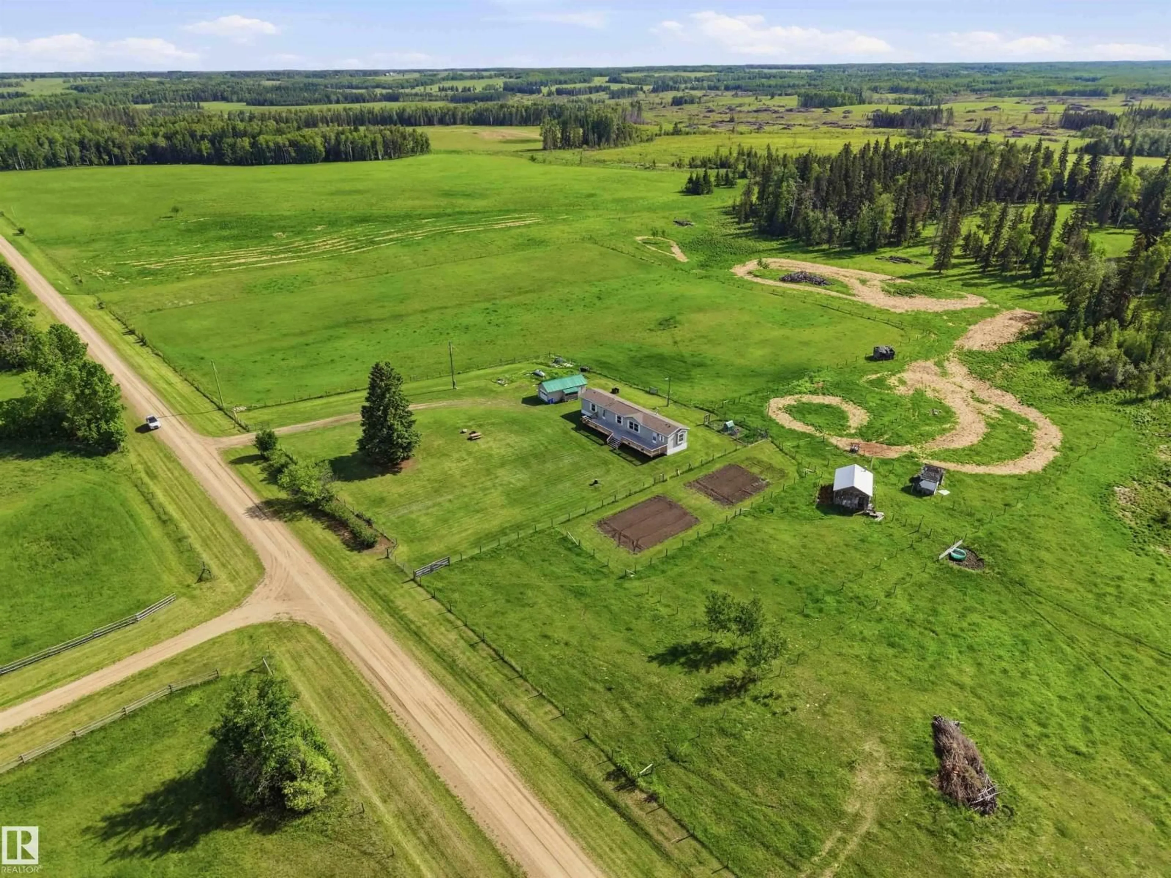 A pic from outside/outdoor area/front of a property/back of a property/a pic from drone, unknown for 55213 RGE ROAD 62, Rural Lac Ste. Anne County Alberta T0E2A0